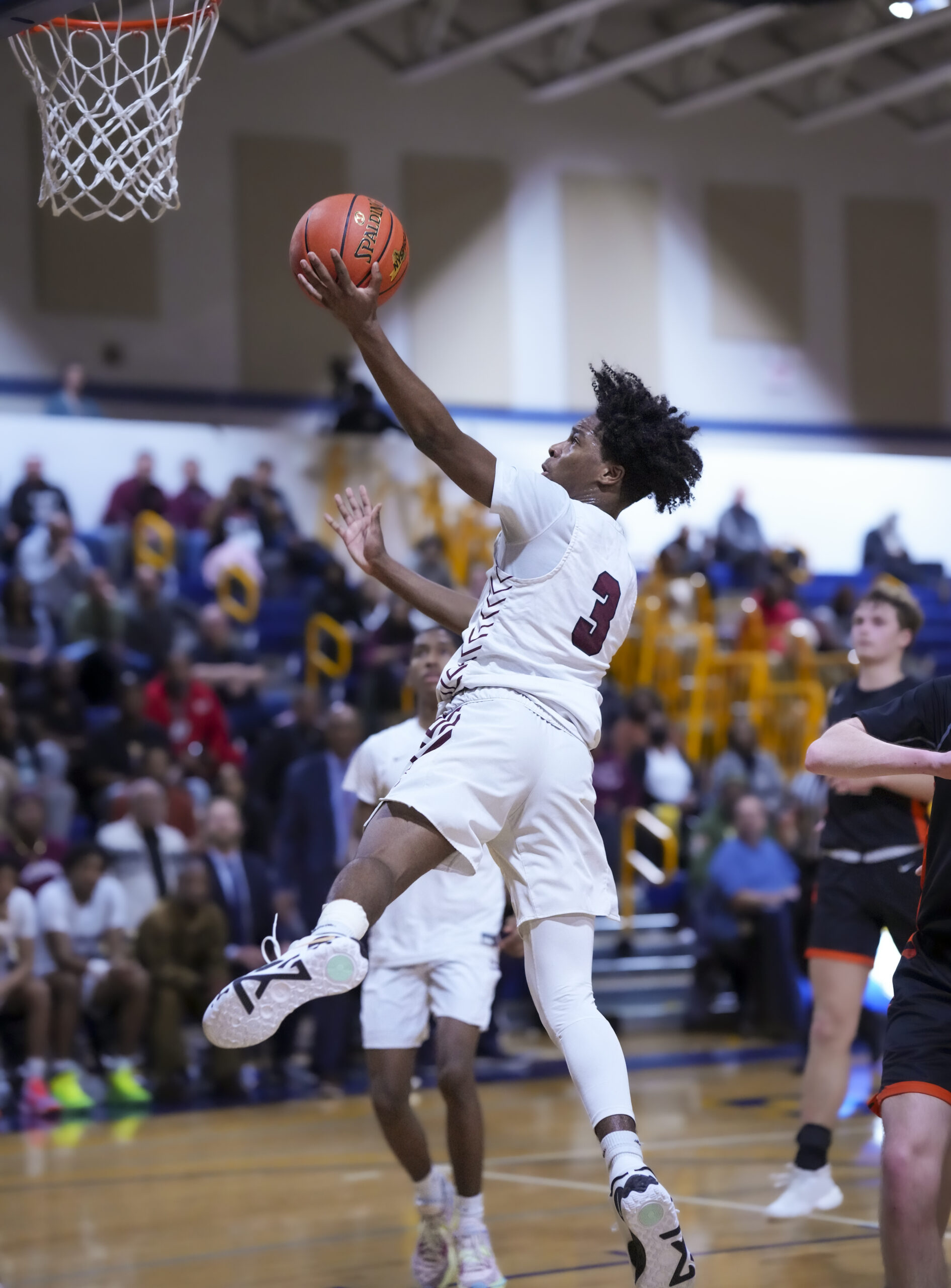 Nursing a sprained ankle, Derek Reed scored 21 points in Wednesday's county-title clinching victory, including his 1,000th career point.   RON ESPOSITO