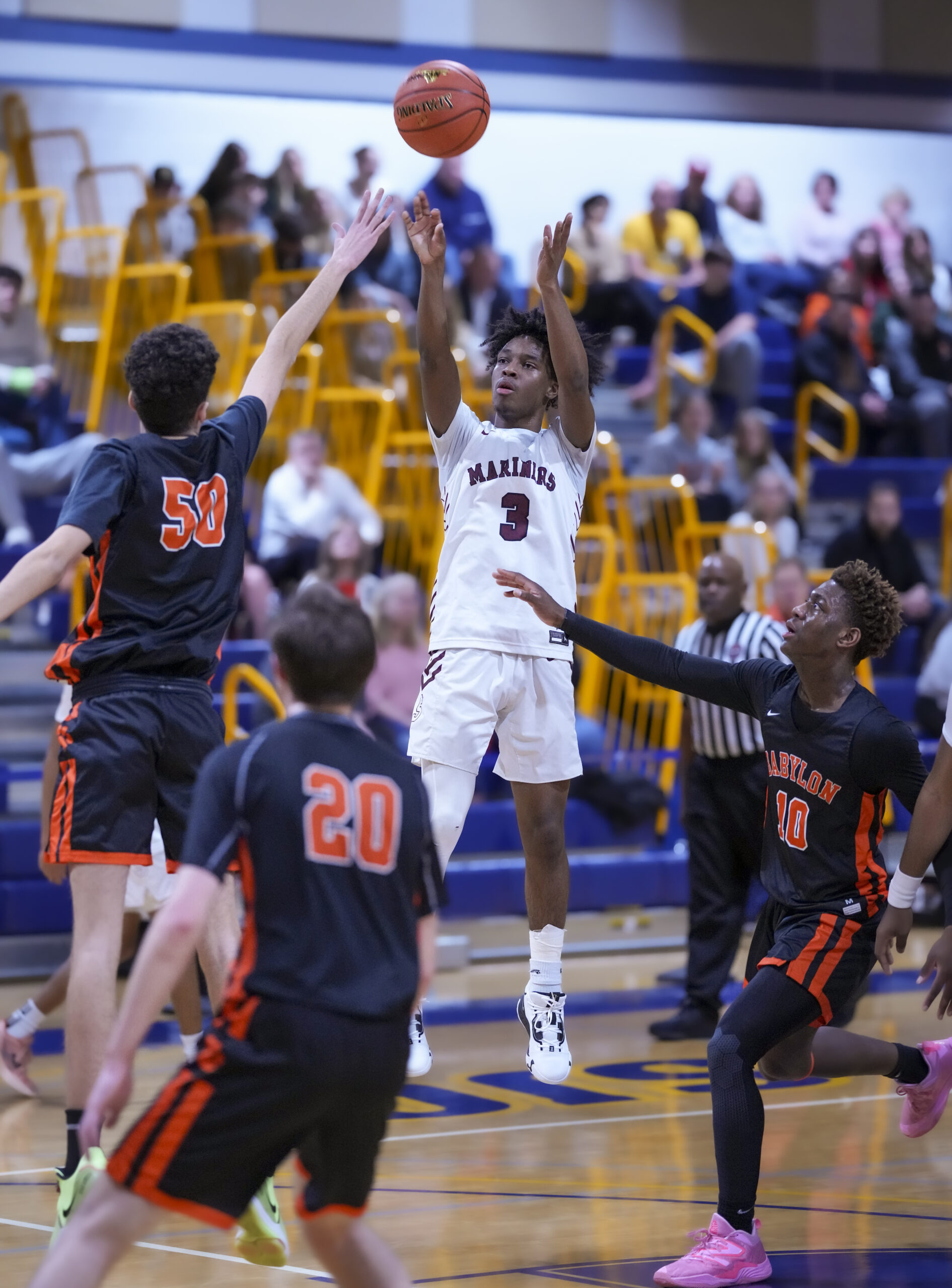 Southampton's Derek Reed shoots over Babylon's Cameron Schweitzer.    RON ESPOSITO