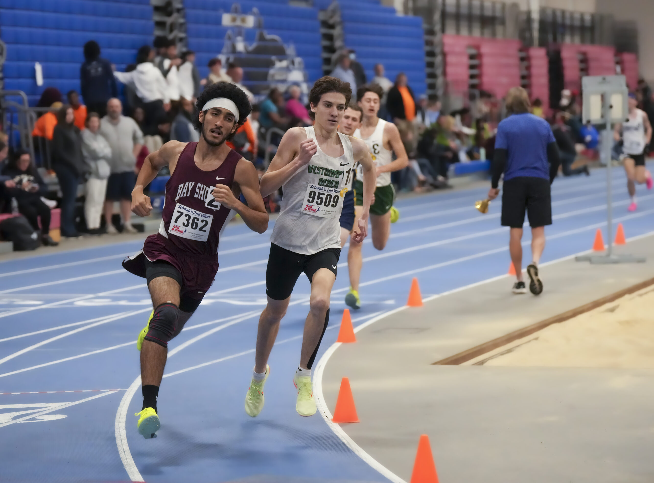 Westhampton Beach junior Trevor Hayes keeps up with Bay Shore senior Dylan Beggins in the 1,600-meter race.   RON ESPOSITO