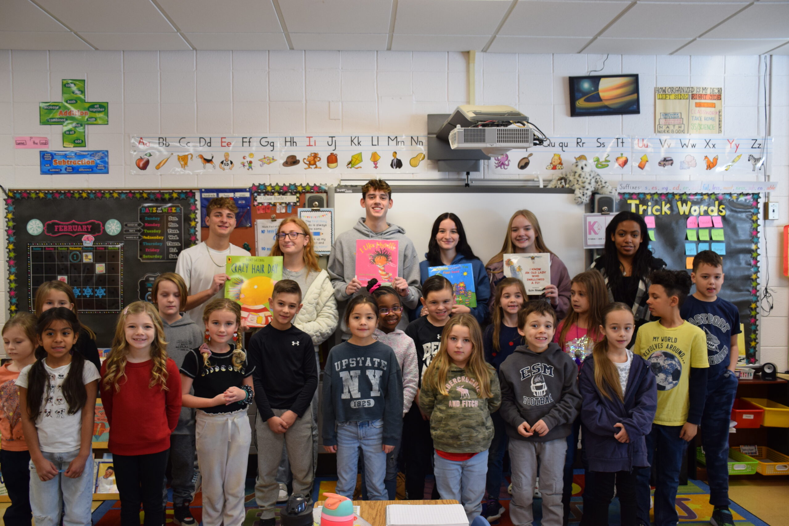 Eastport-South Manor Jr.-Sr. High School students read to students at South Street Elementary School on Word Read Aloud Day. COURTESY EASTPORT-SOUTH MANOR SCHOOL DISTRICT