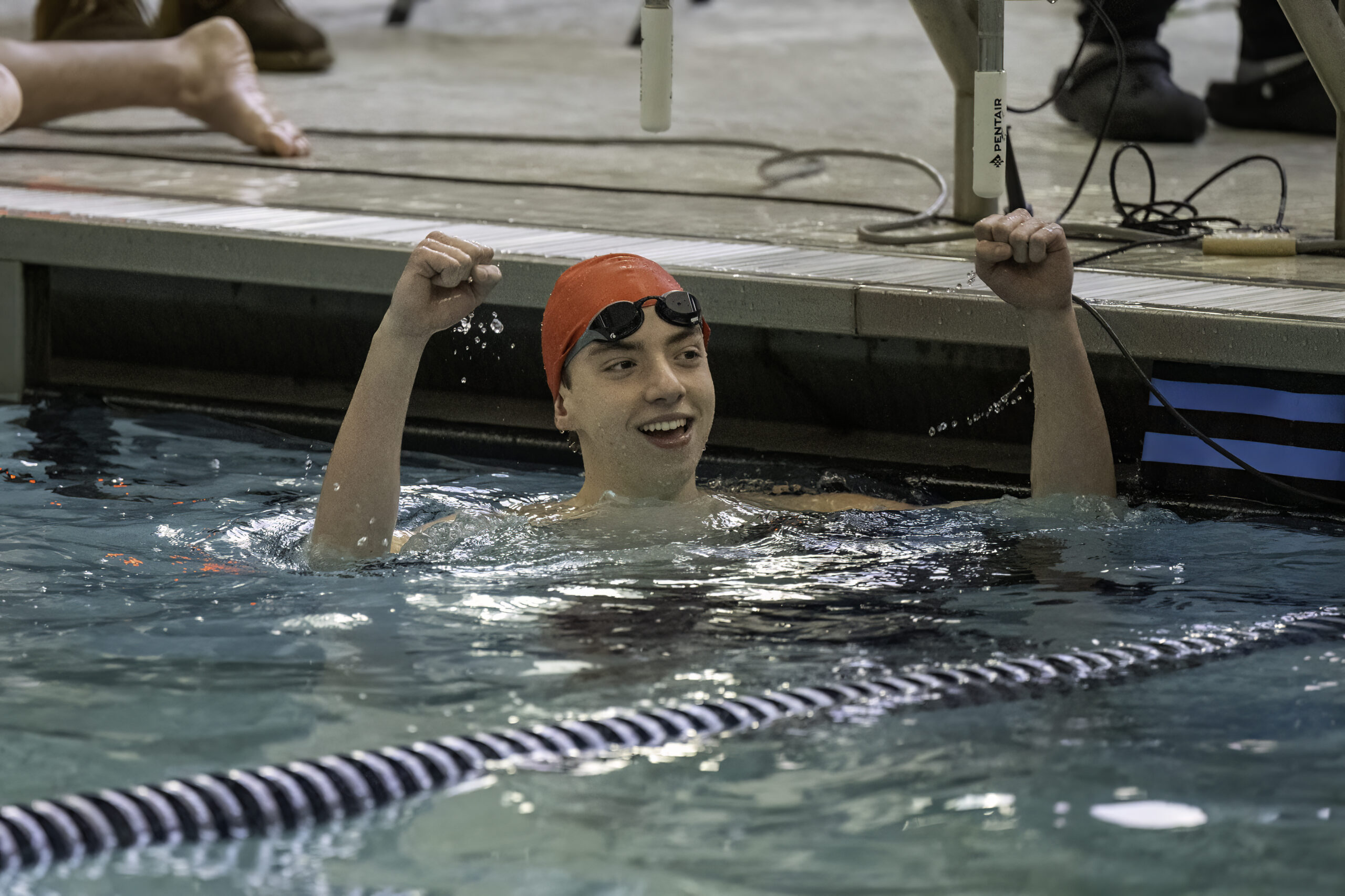 Westhampton Beach junior Max Buchen looks at the clock and celebrates his time in the 100-yard breaststroke. MARIANNE BARNETT