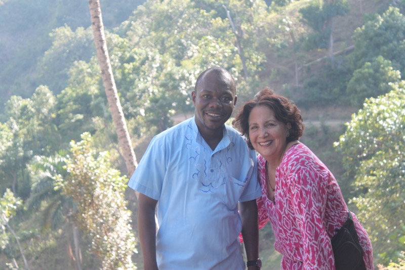 Pére André Wildaine, our partner in Haiti who oversees our projects and Co-founder Lila Meade on the two hour hike up the mountain from the riverbed.