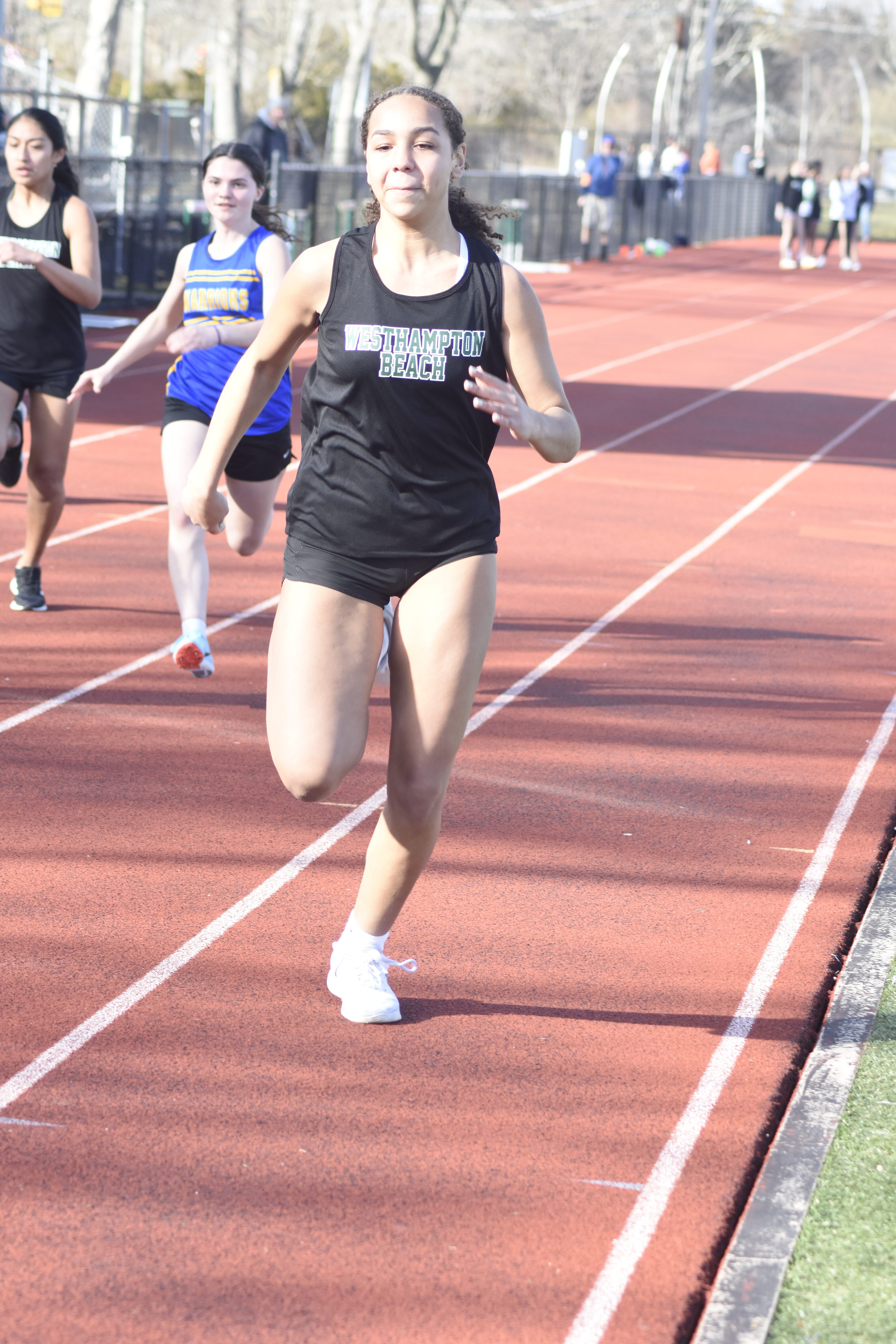 Jasmine Taylor competing in the 100-meter dash during Friday's dual meet against Comsewogue.   DREW BUDD