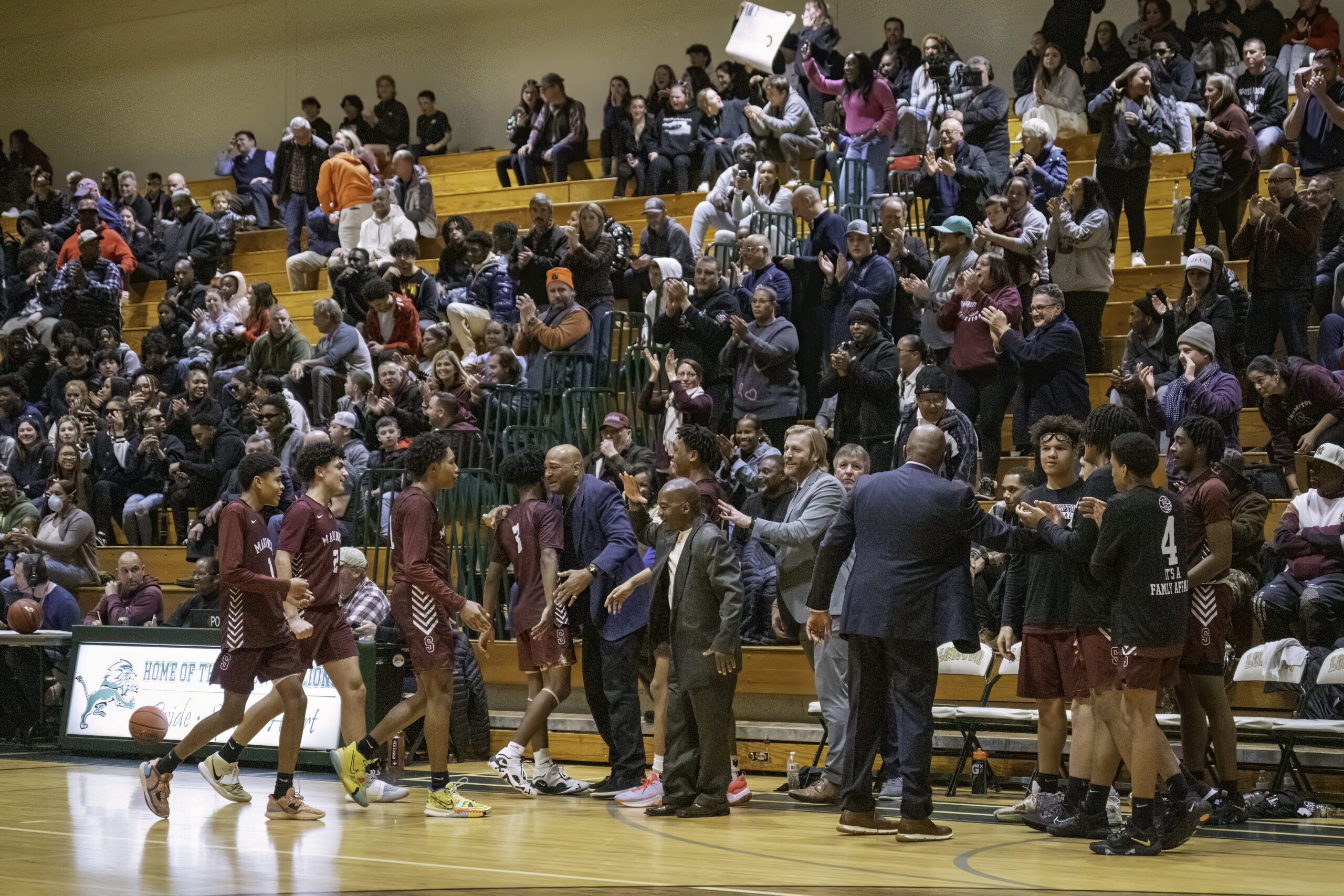 The large Southampton crowd in attendance at Longwood High School gives its team a standing ovation after it starts to pull away with the game late.   MARIANNE BARNETT