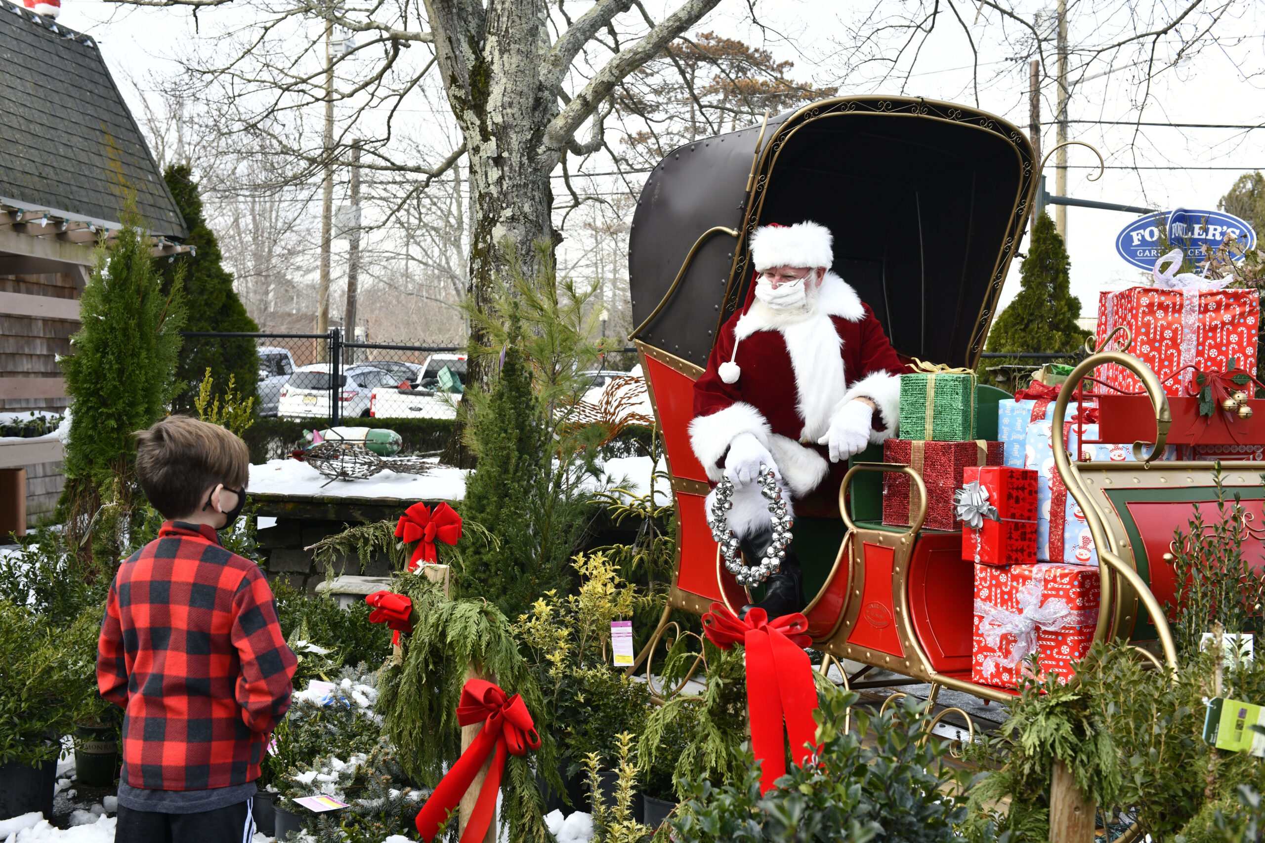 The was no sitting on Santa's lap in December of 2020. The Santa at Fowler's Garden Center in Southampton practiced social distancing.  DANA SHAW