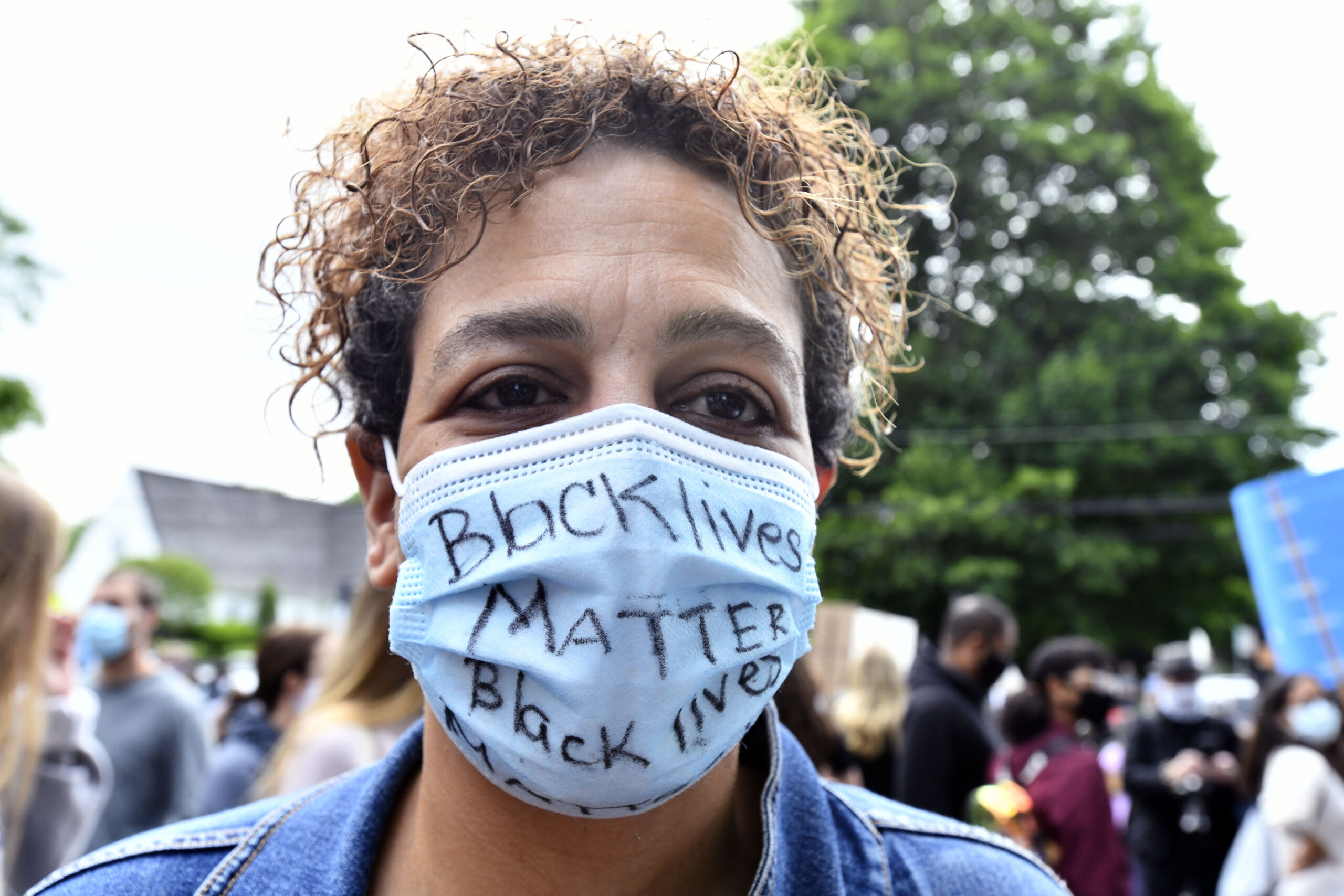 Masks became a common sight in everyday life. Hundreds of people attended the Black Lives Matter protest in Bridgehampton in June of 2020, masked.  DANA SHAW