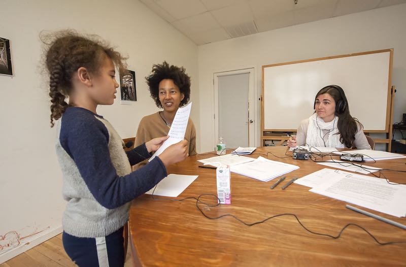 John Jermain Librarian Mireille Sturmann records a passage by young Ada Liberson while Brooke Williams looks on as 