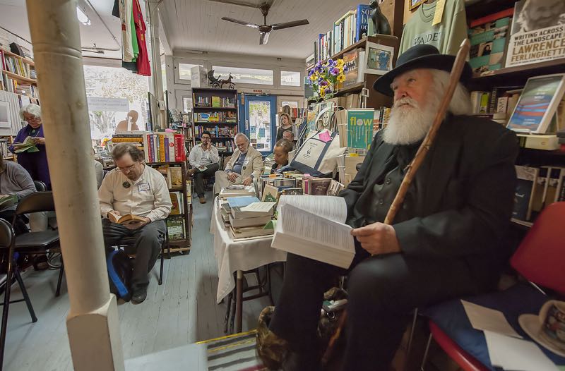 Walt Whitman lookalike and impersonator Darrel Blaine Ford listens intently as John Dagney reads a passage during a marathon reading of Walt Whitman's 