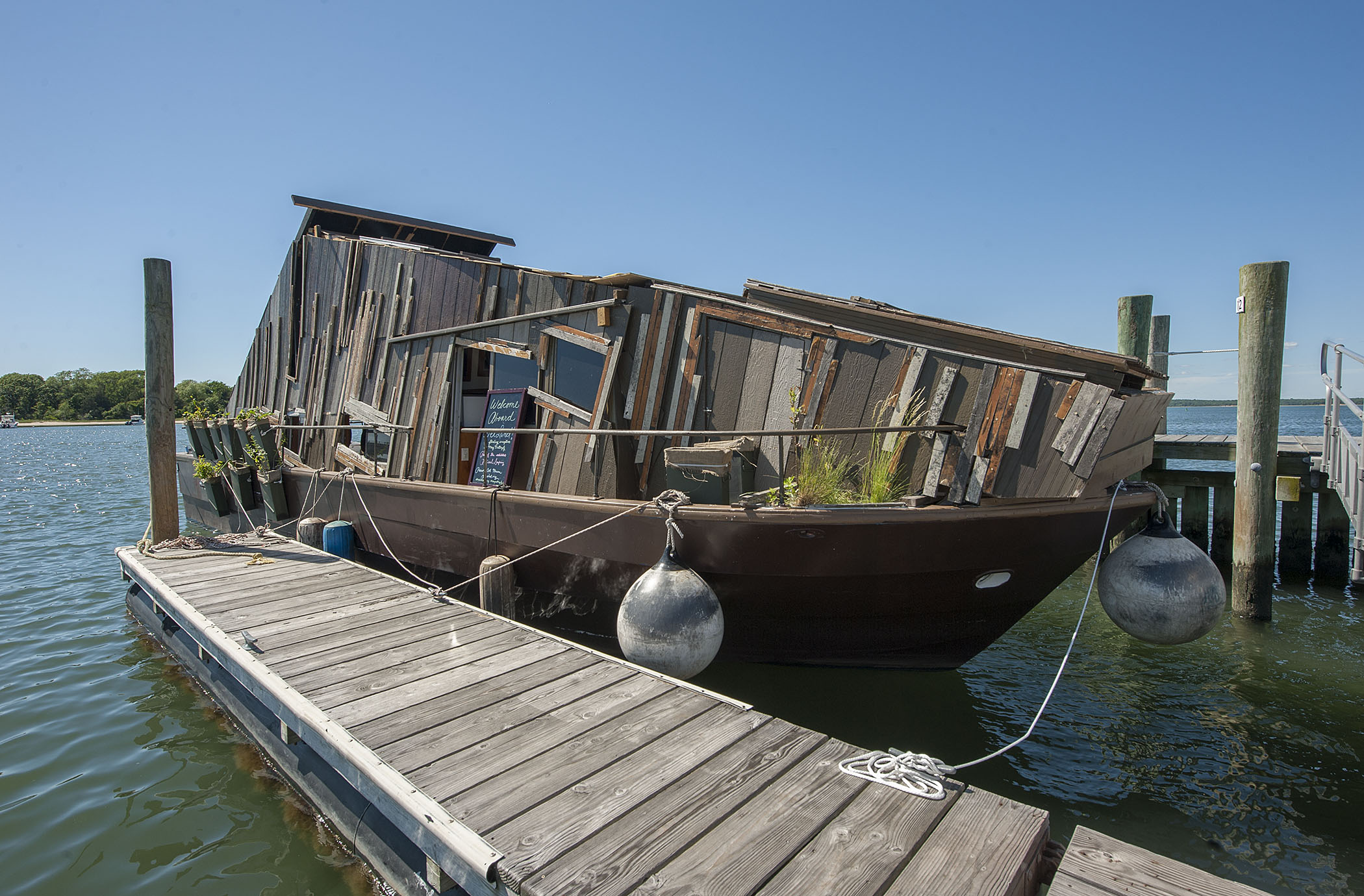 The Wetlands Project barge docked at the floating commercial dock off Long Wharf. Michael Heller photo