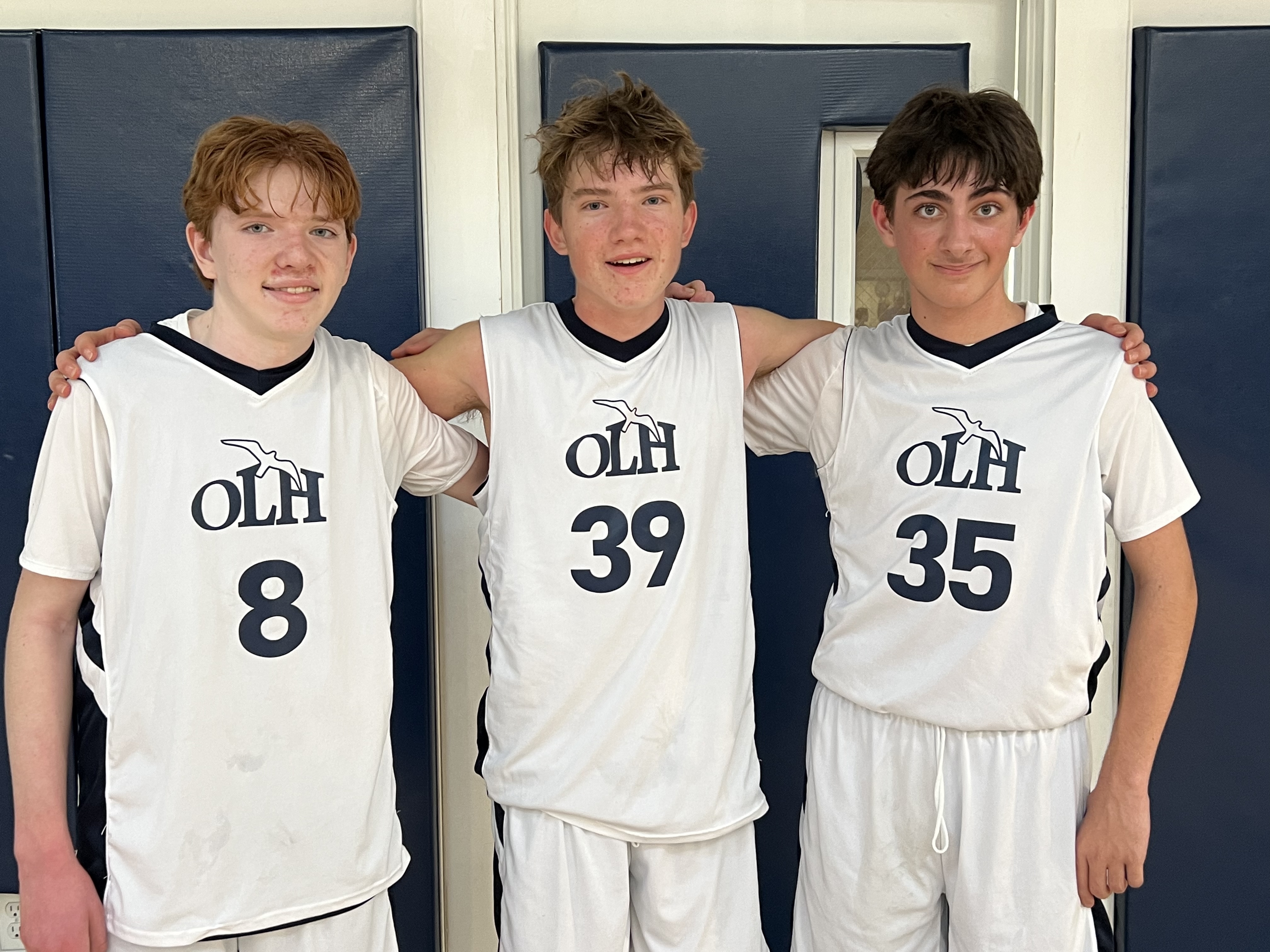 Our Lady of the Hamptons eighth graders, from left, Michael Campbell, Maxwell Notley and James Paccasassi.