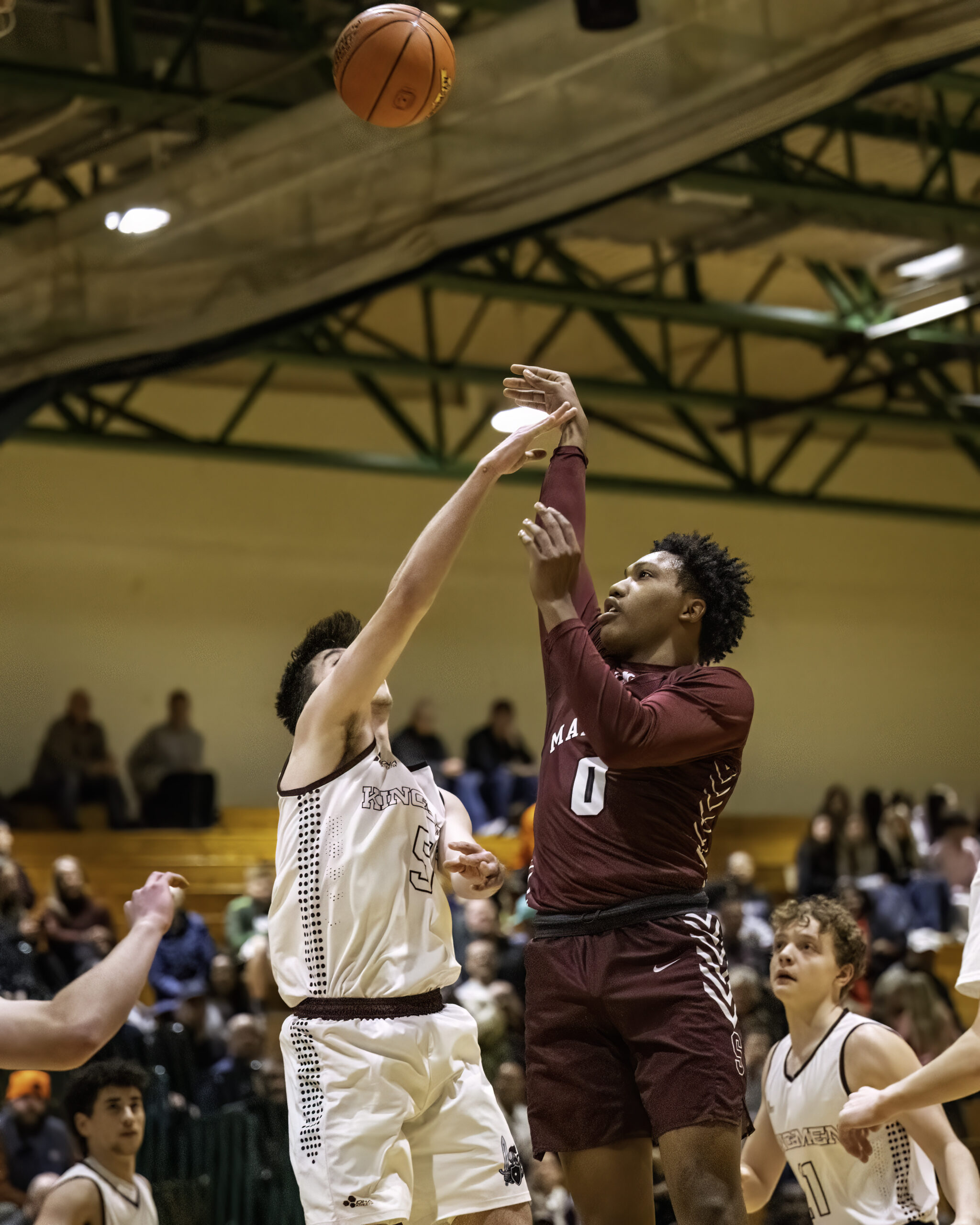 Southampton sophomore Naevon Williams gets a shot up and over Kings Park senior Matthew Garside.   MARIANNE BARNETT