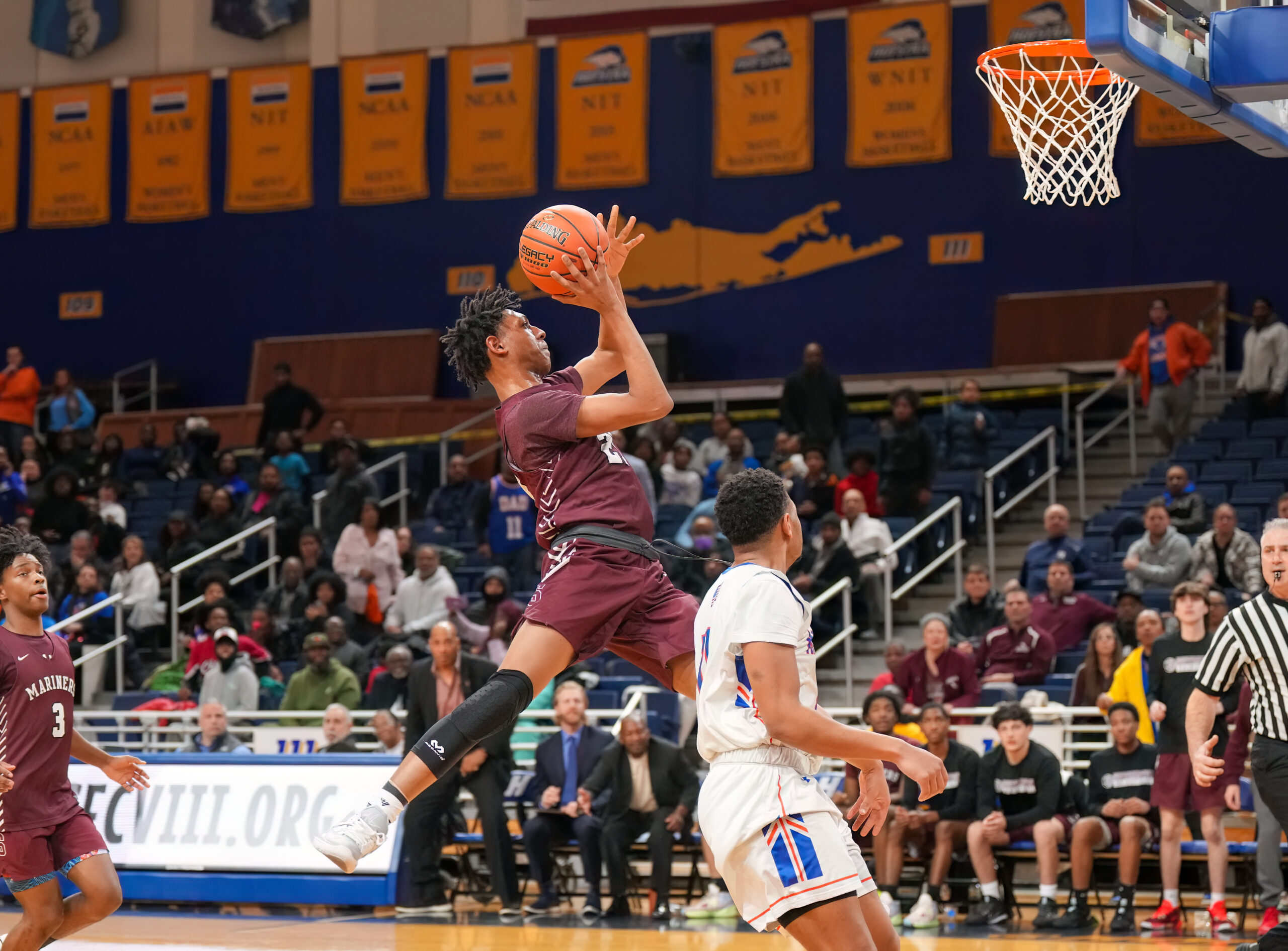 Southampton sophomore Nikai Pierson puts up an awkward shot that he makes. His six points in the fourth quarter and strong defense all game played a big factor in the Mariners' victory.   RON ESPOSITO