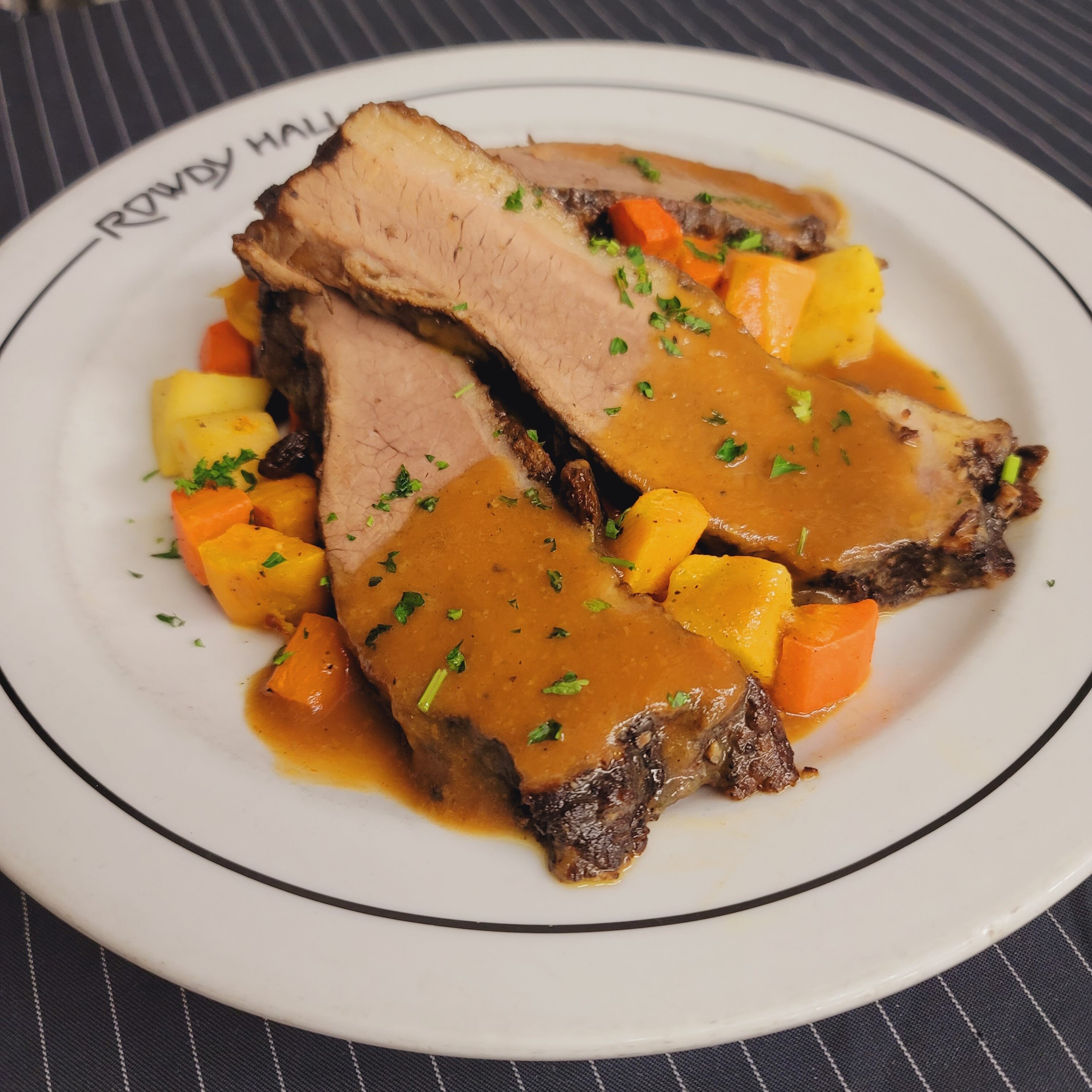 Rowdy Hall's Passover offerings include red wine braised brisket with sweet potato puree and roasted baby root vegetables. COURTESY ROWDY HALL