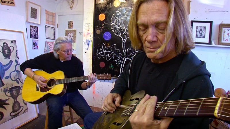 Dan Rizzie, left, plays a tune with guitarist G.E. Smith.