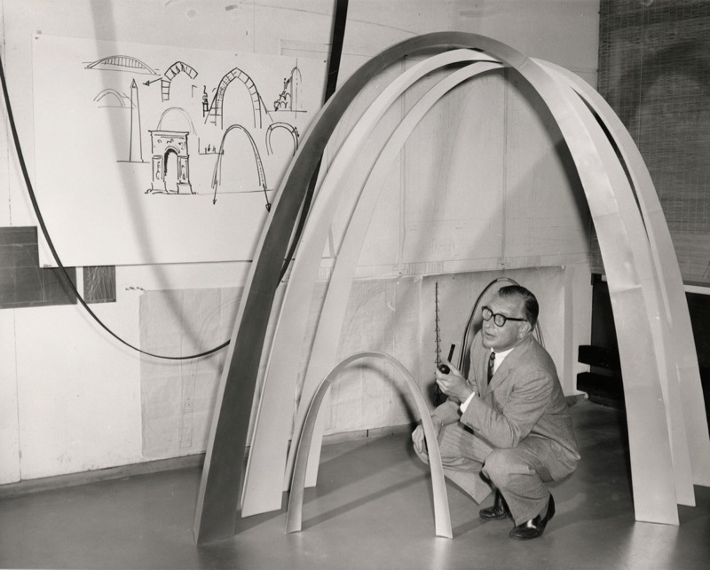 Architect Eero Saarinen contemplating renderings for the arch he designed as an iconic figure for the city of St. Louis, featured in the film 