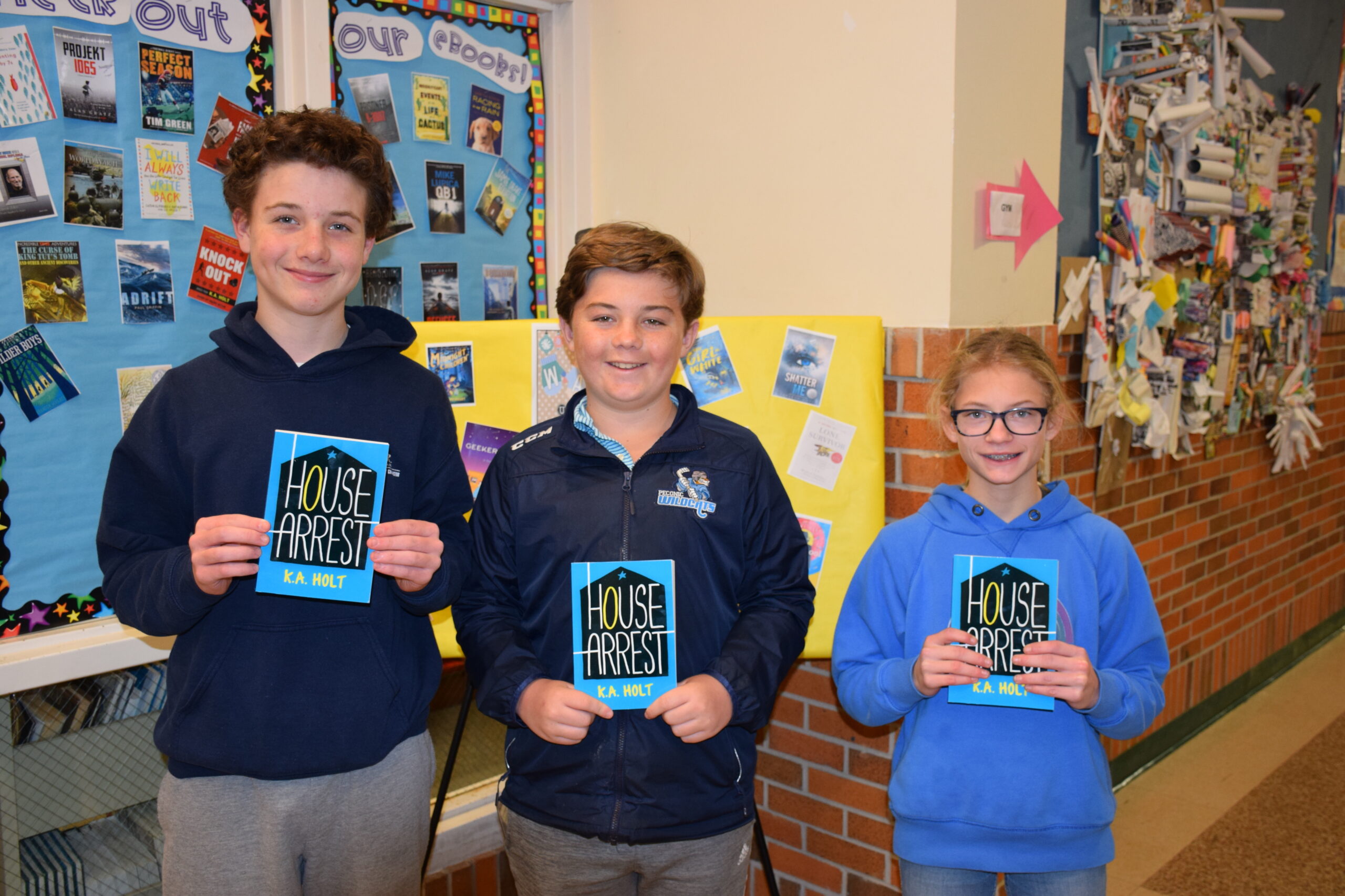 Westhampton Beach Middle School students are celebrating the school’s 18th annual community read, where they, along with staff and parents, are all reading and discussing the same book, “House Arrest,” by K.A. Holt. The community read will culminate with a Community Read Night on March 9, where the book will be celebrated through various activities. Students who participated included, from left. Carter Trelease, Gus O’Callaghan and Olivia Walsk. COURTESY WESTHAMPTON BEACH SCHOOL DISTRICT