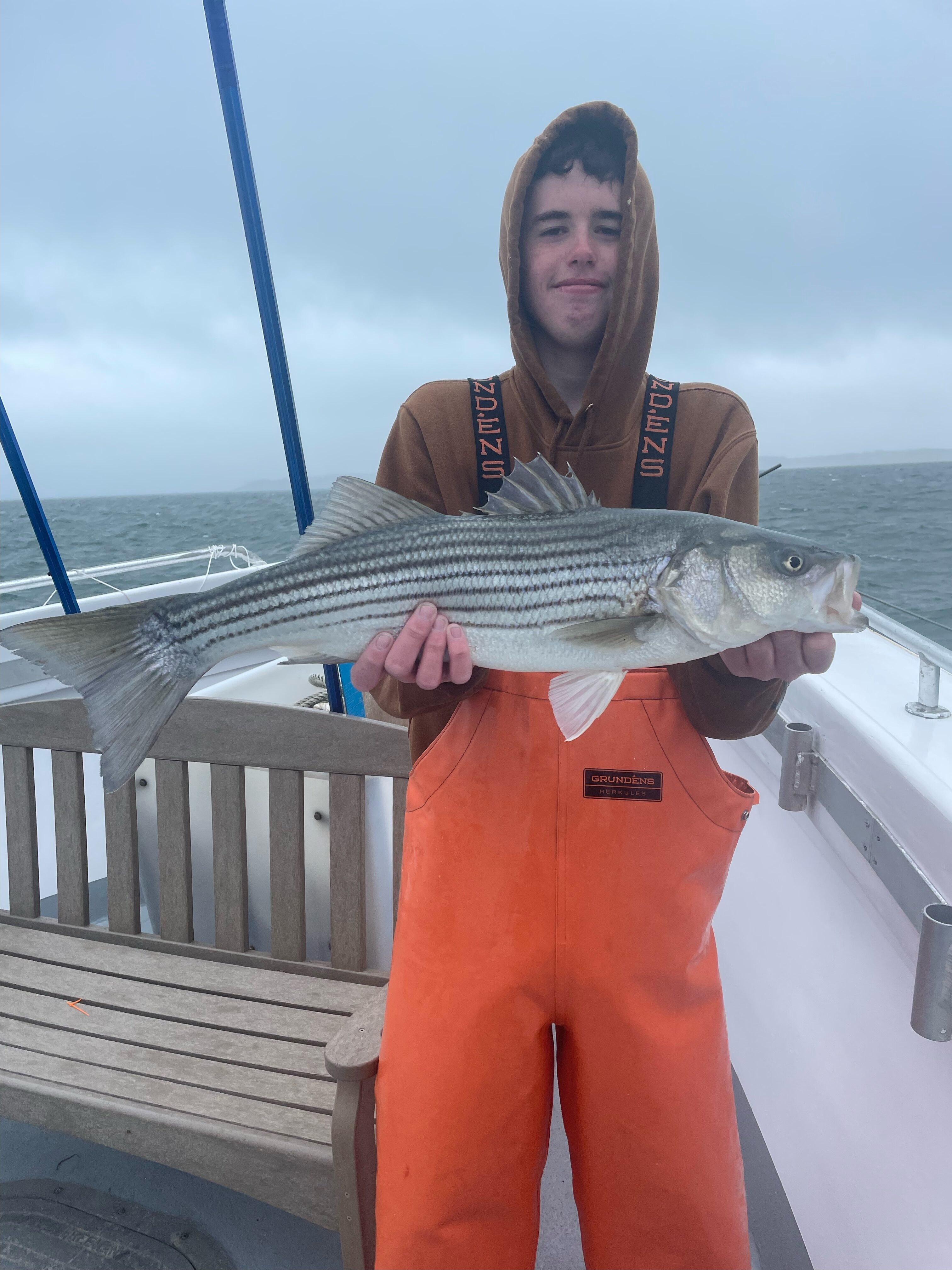 Kevin Kelly from Hampton Bays with a striper caught aboard the Hampton Lady over the weekend. Stripers have arrived in the local surf early again this year.