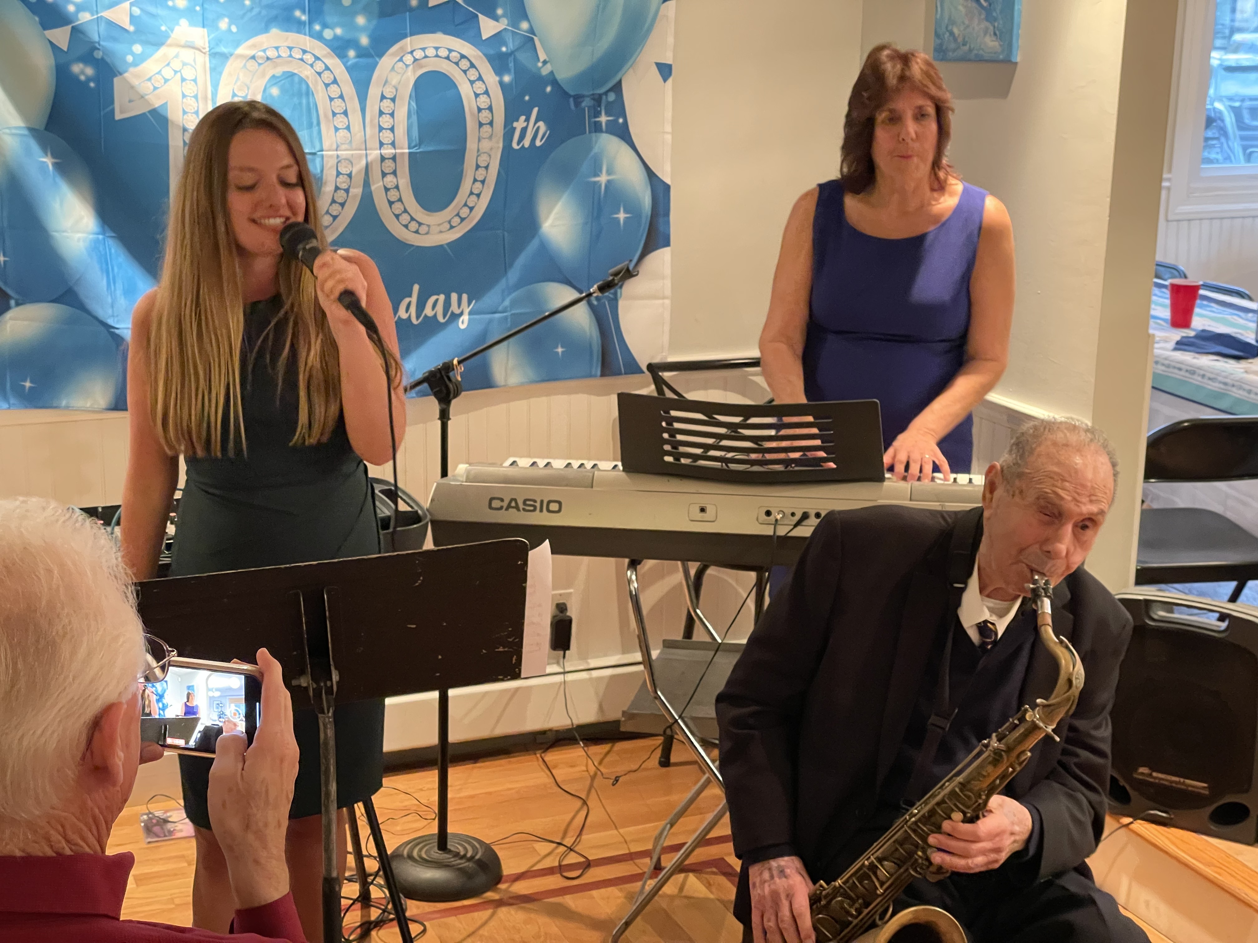 Pat DeRosa with his daughter, Patricia DeRosa Padden, and his granddaughter, Nicole DeRosa Padden, performing together.