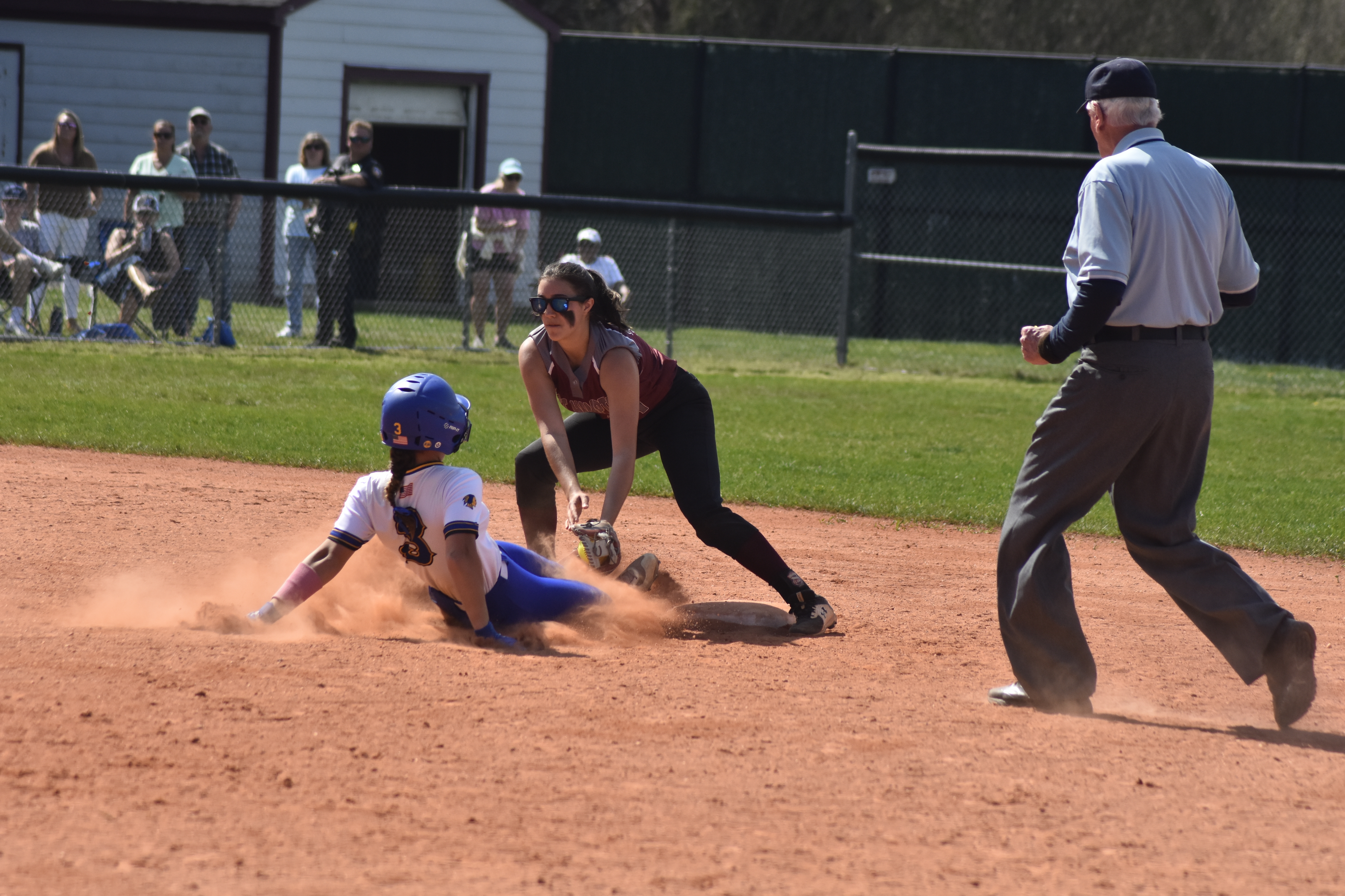 East Hampton senior shortstop Emma Terry tags out a Comsewogue runner trying to steal second base off a strong throw from sophomore catcher Susie DiSunno.   DREW BUDD