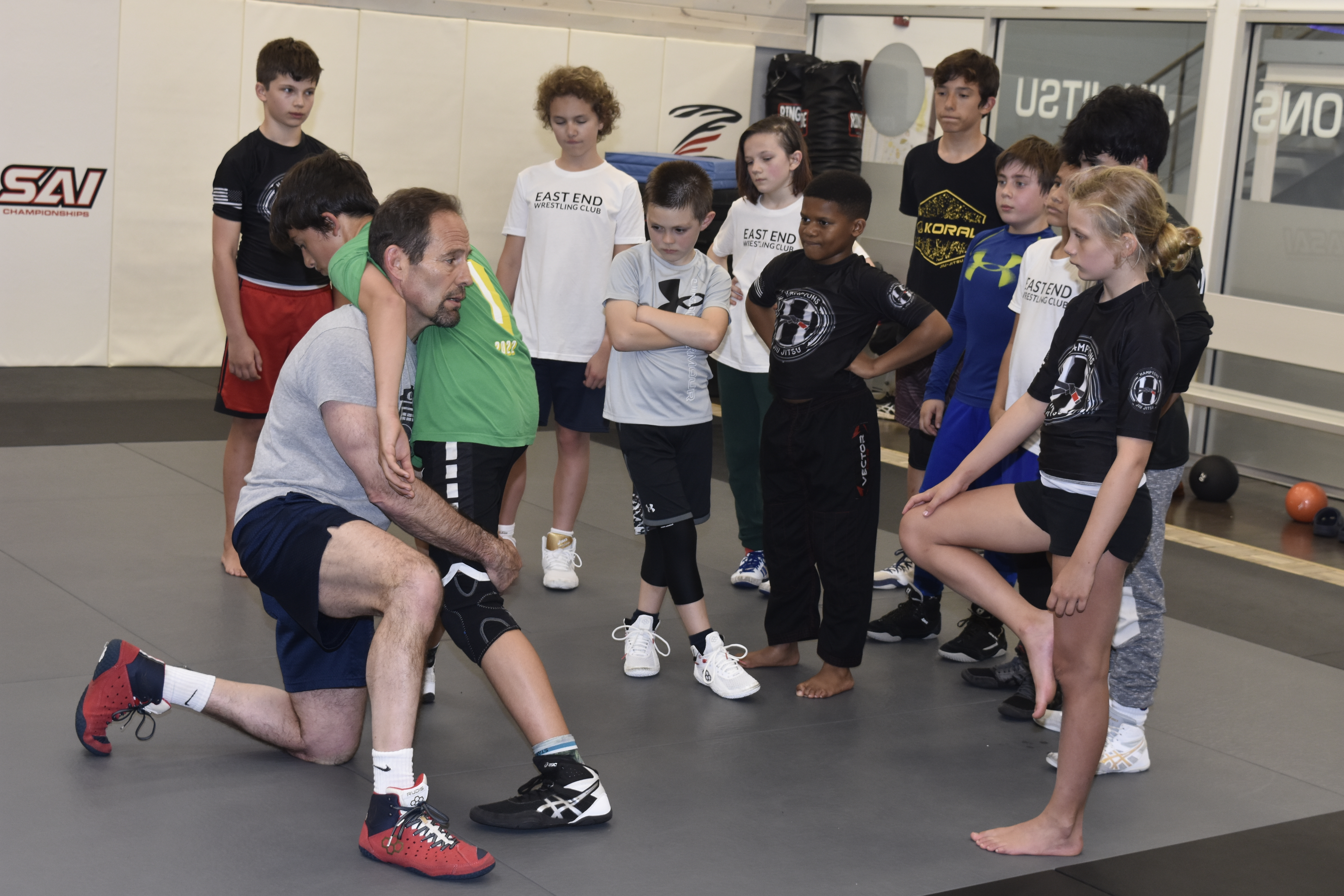 Hall of Fame coach Jon Tush leads a class of fourth-eighth graders on Monday.   DREW BUDD