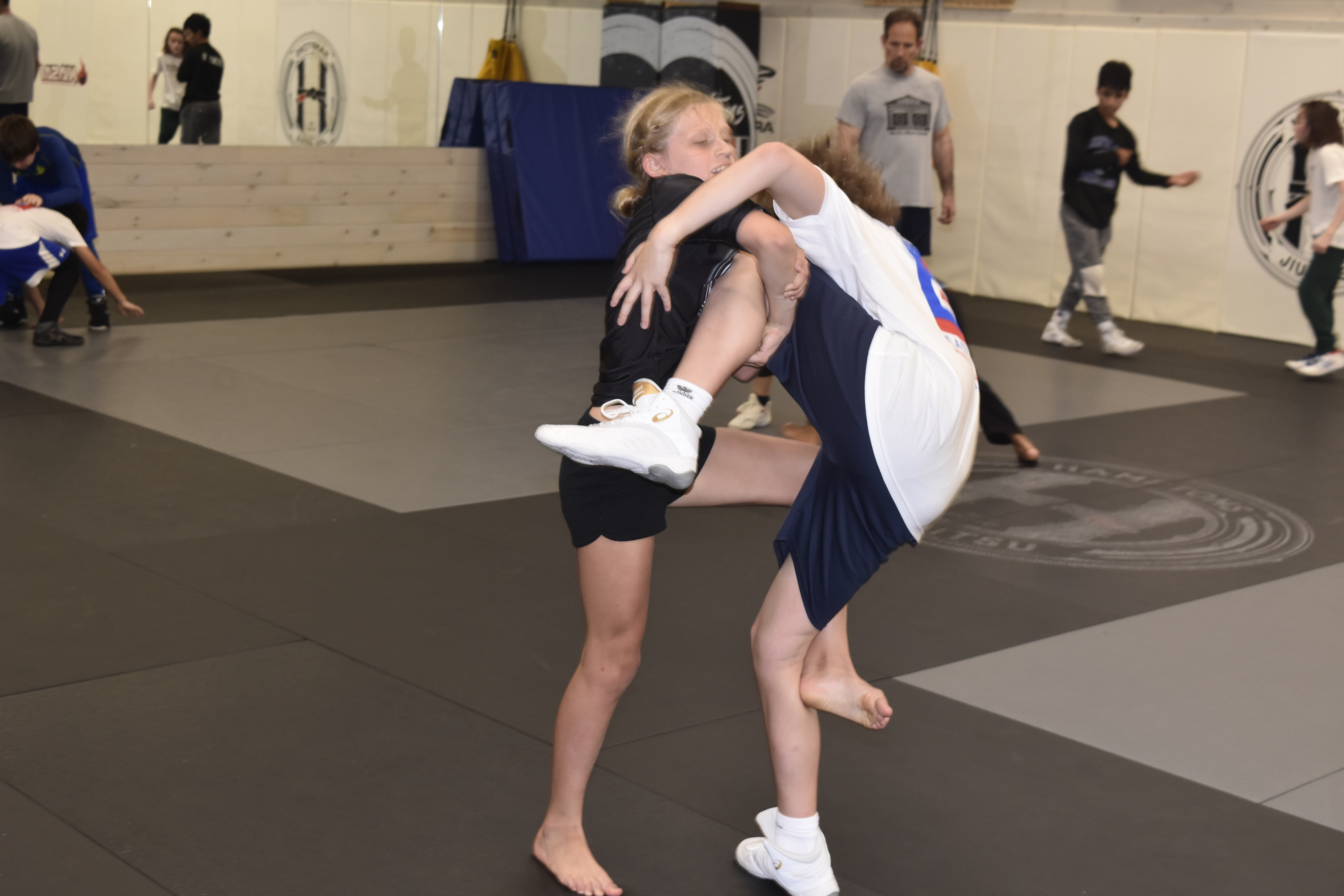 Young wrestlers practice their moves.   DREW BUDD