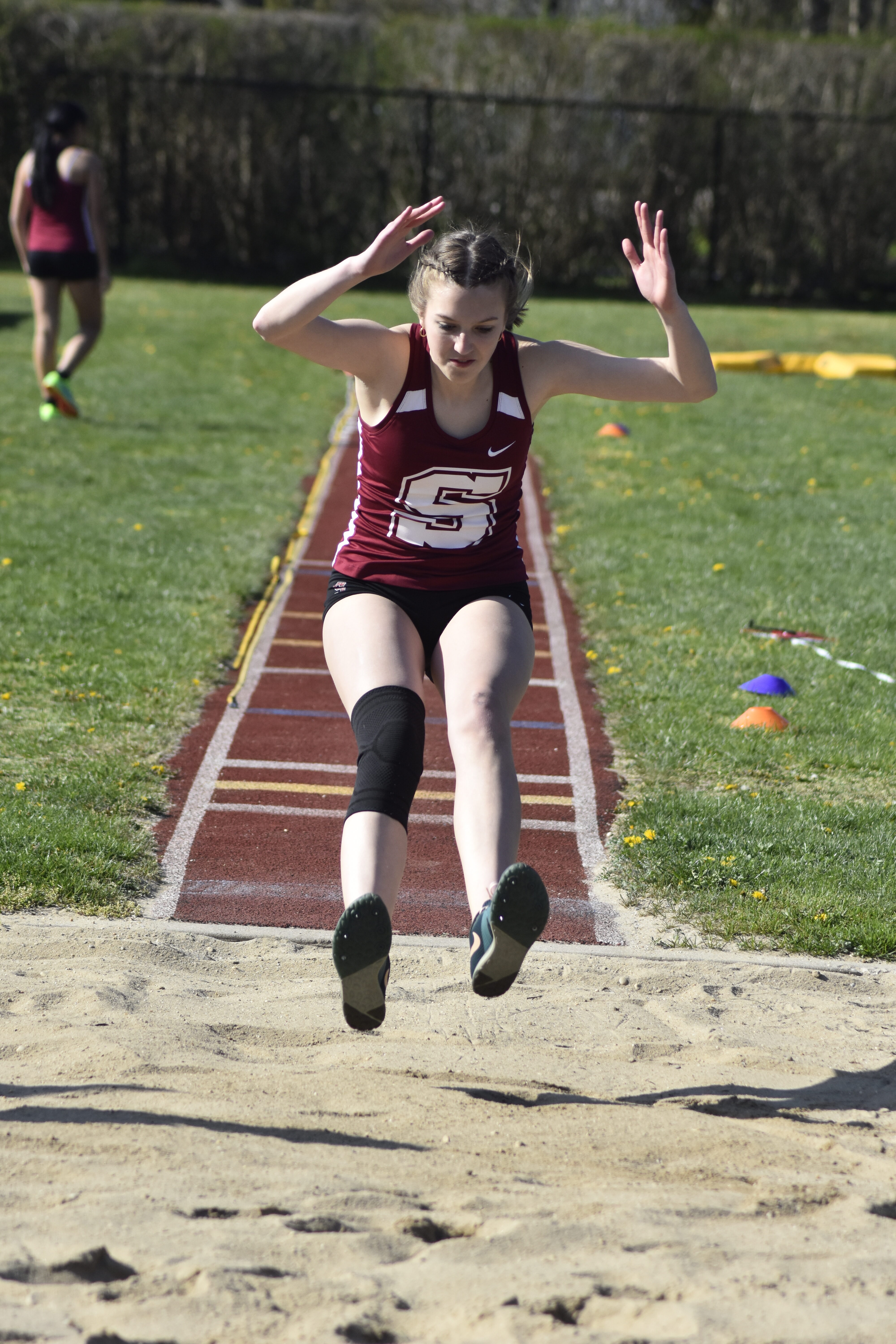 Emma Marcillo competing in the triple jump against Mattituck on April 19.  DREW BUDD