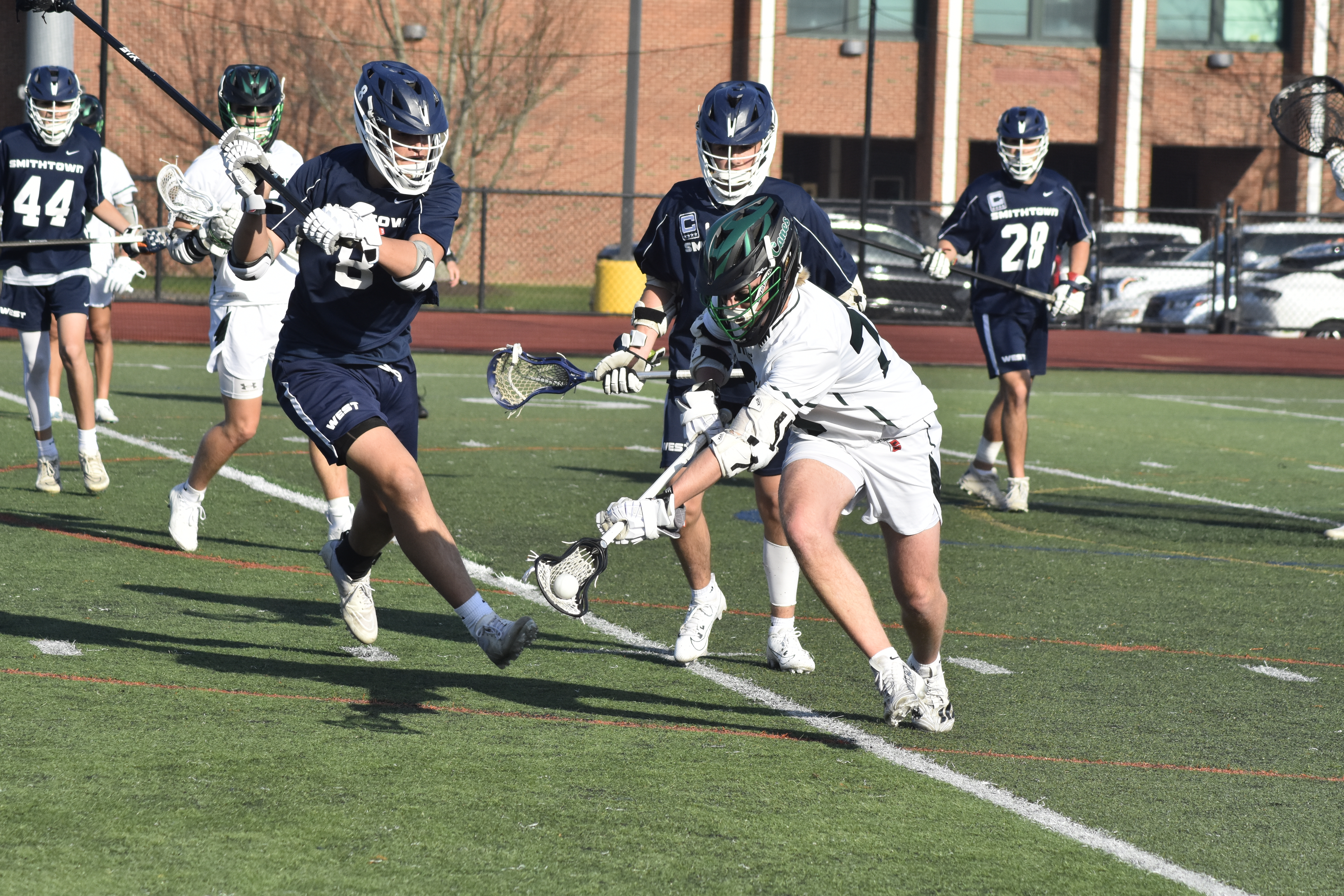 Westhampton Beach junior Will Drake scoops up a ground ball.   DREW BUDD