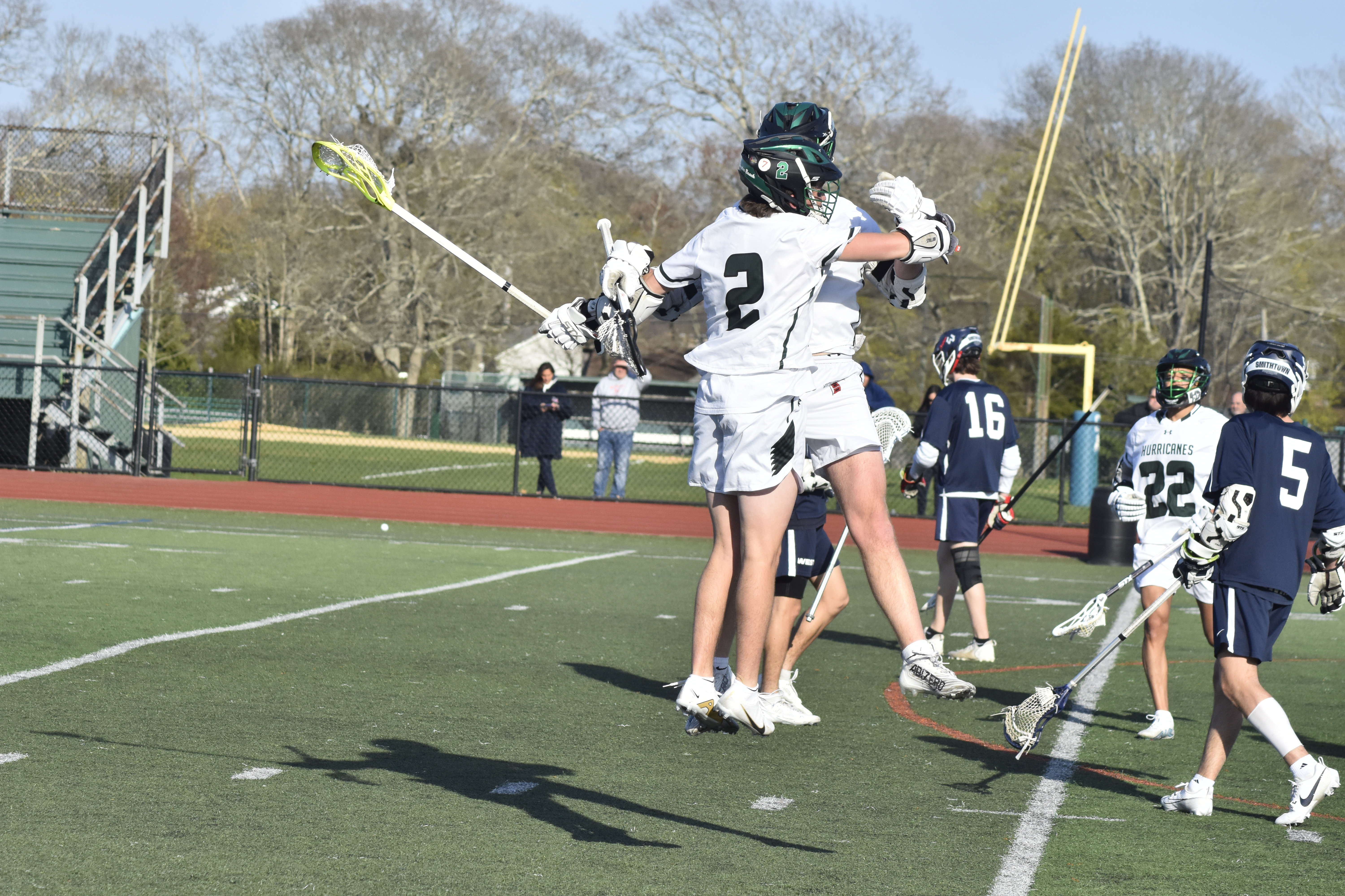 Westhampton Beach juniors Heath Sumwalt (2) and Will Drake celebrate Drake's goal.   DREW BUDD