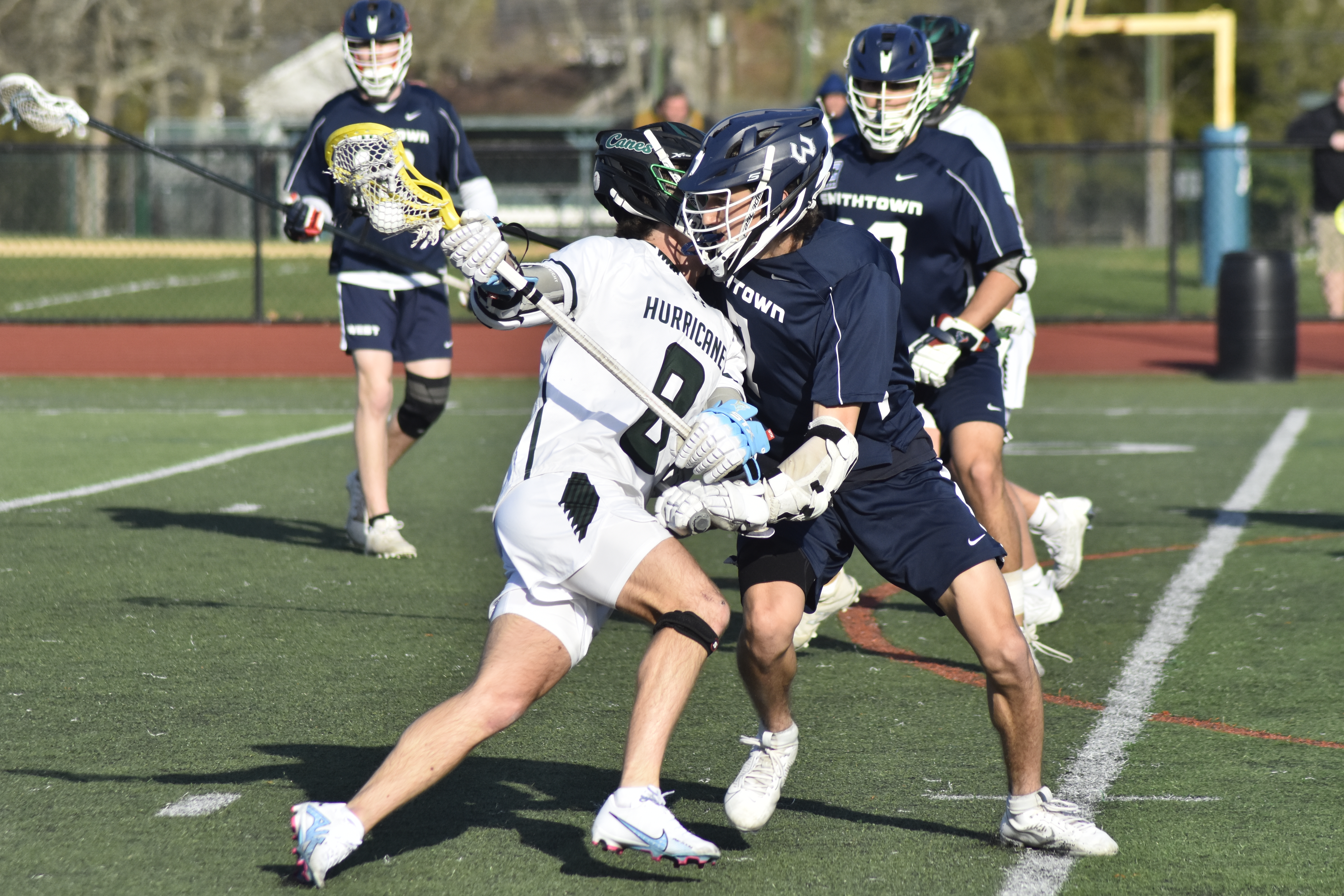 Westhampton Beach senior Morgan McEntee charges in on a Smithtown West defender.  DREW BUDD