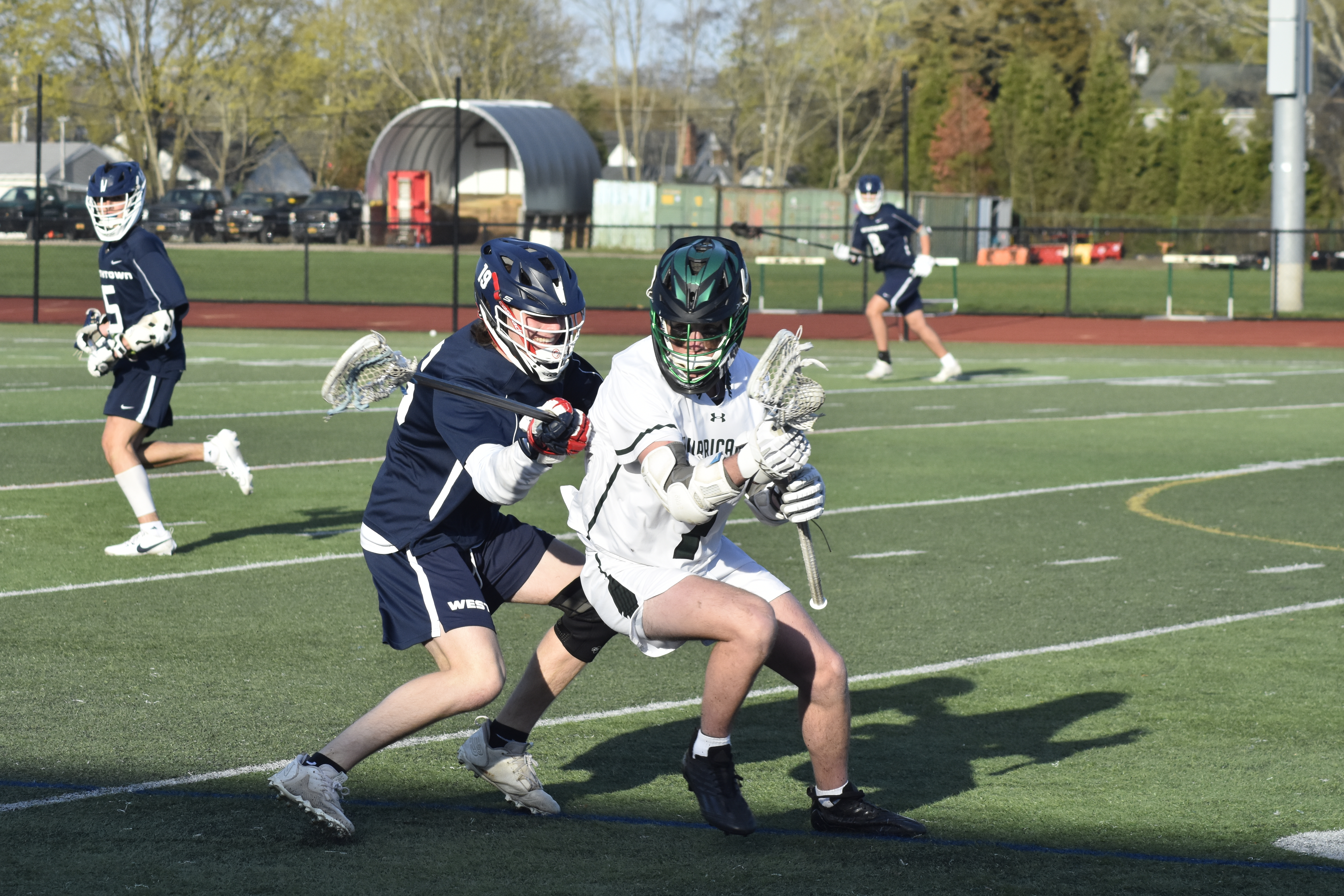 Westhampton Beach sophomore Finn Drake works against a Smithtown West player at midfield.   DREW BUDD