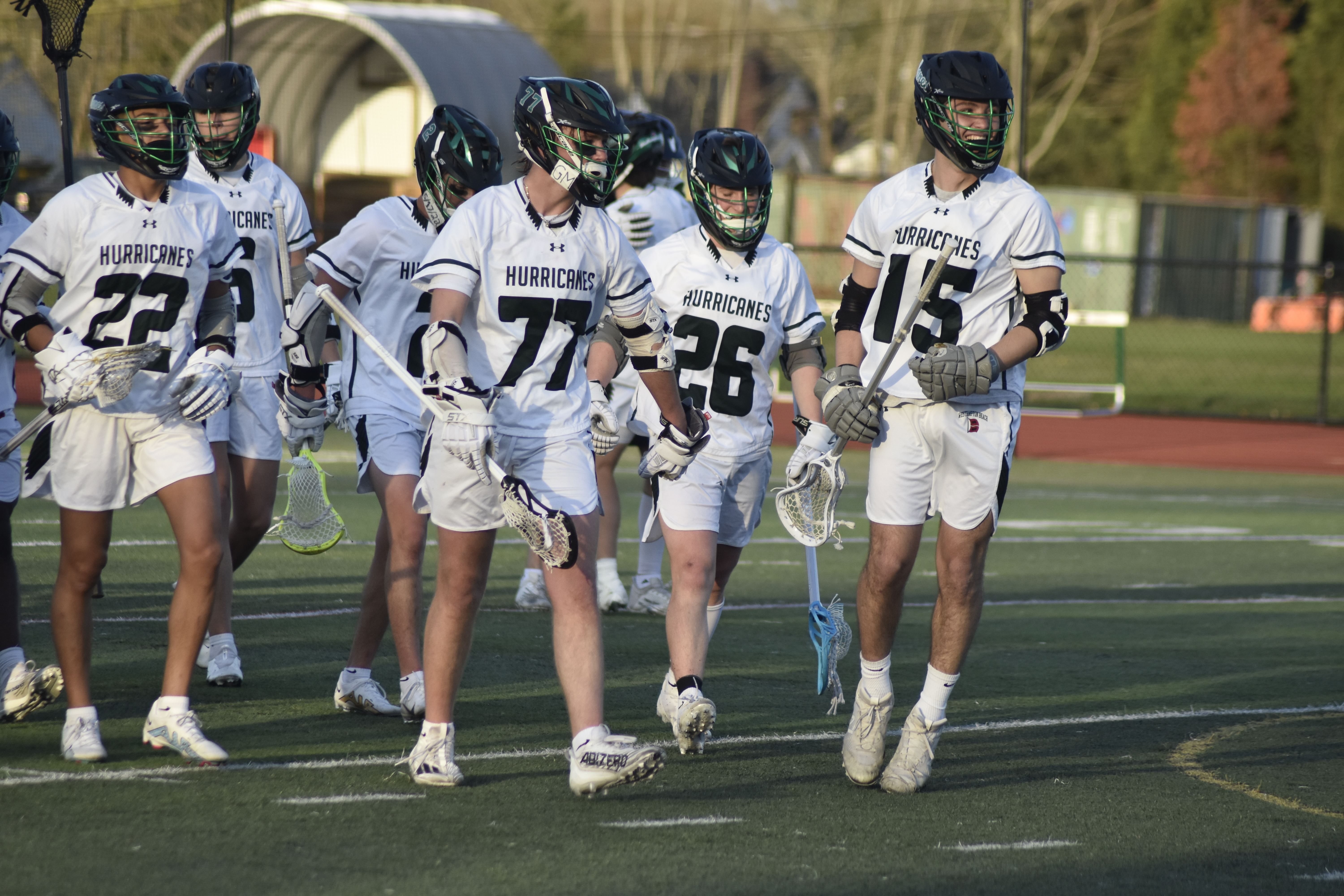 The Hurricanes walk of their home turf with all smiles after defeating Smithtown West, 15-11, on Thursday.   DREW BUDD