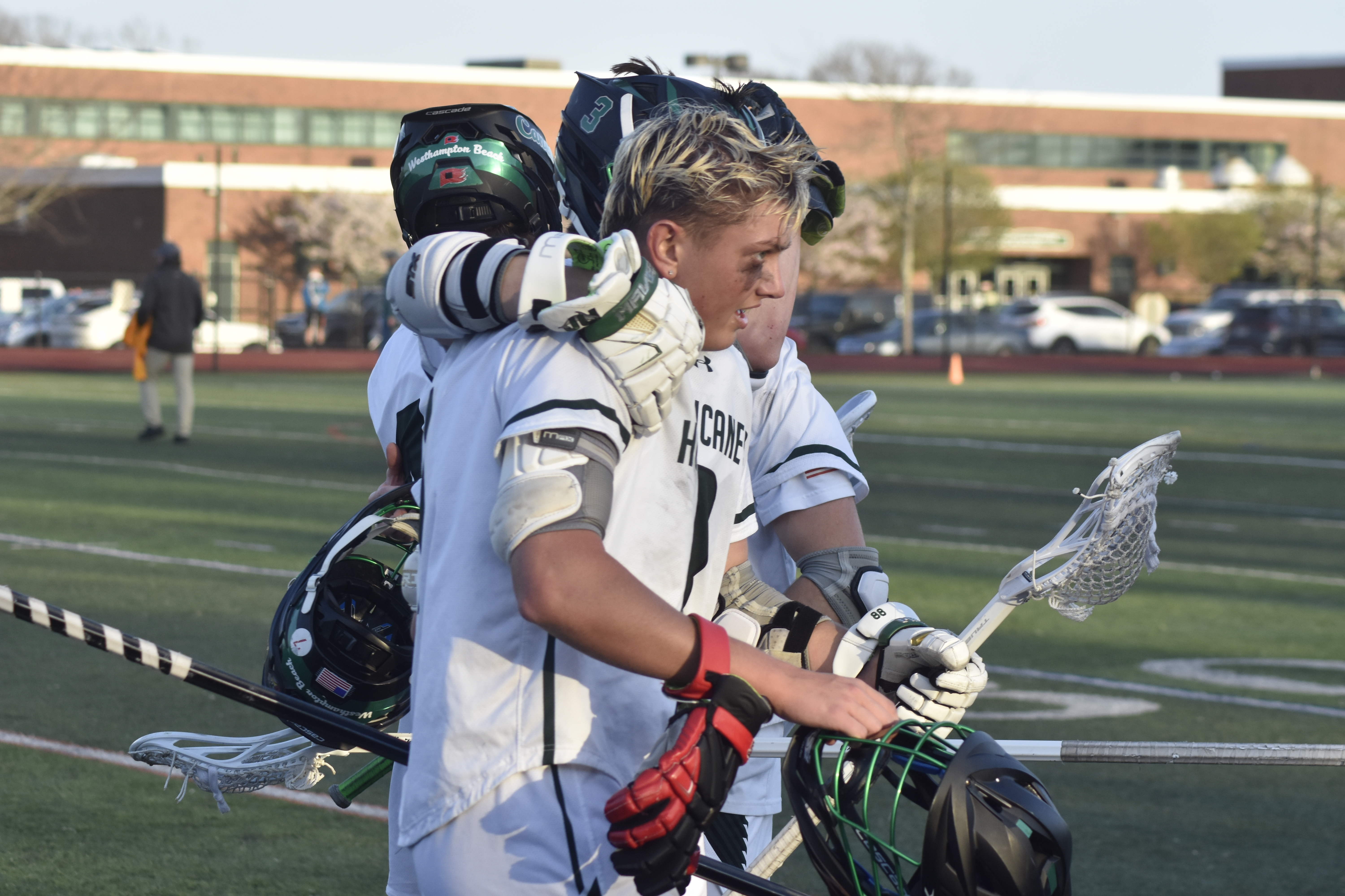 Chance Brindle puts his arm around teammate Aidan McAuley after they defeated Smithtown West on Thursday.   DREW BUDD