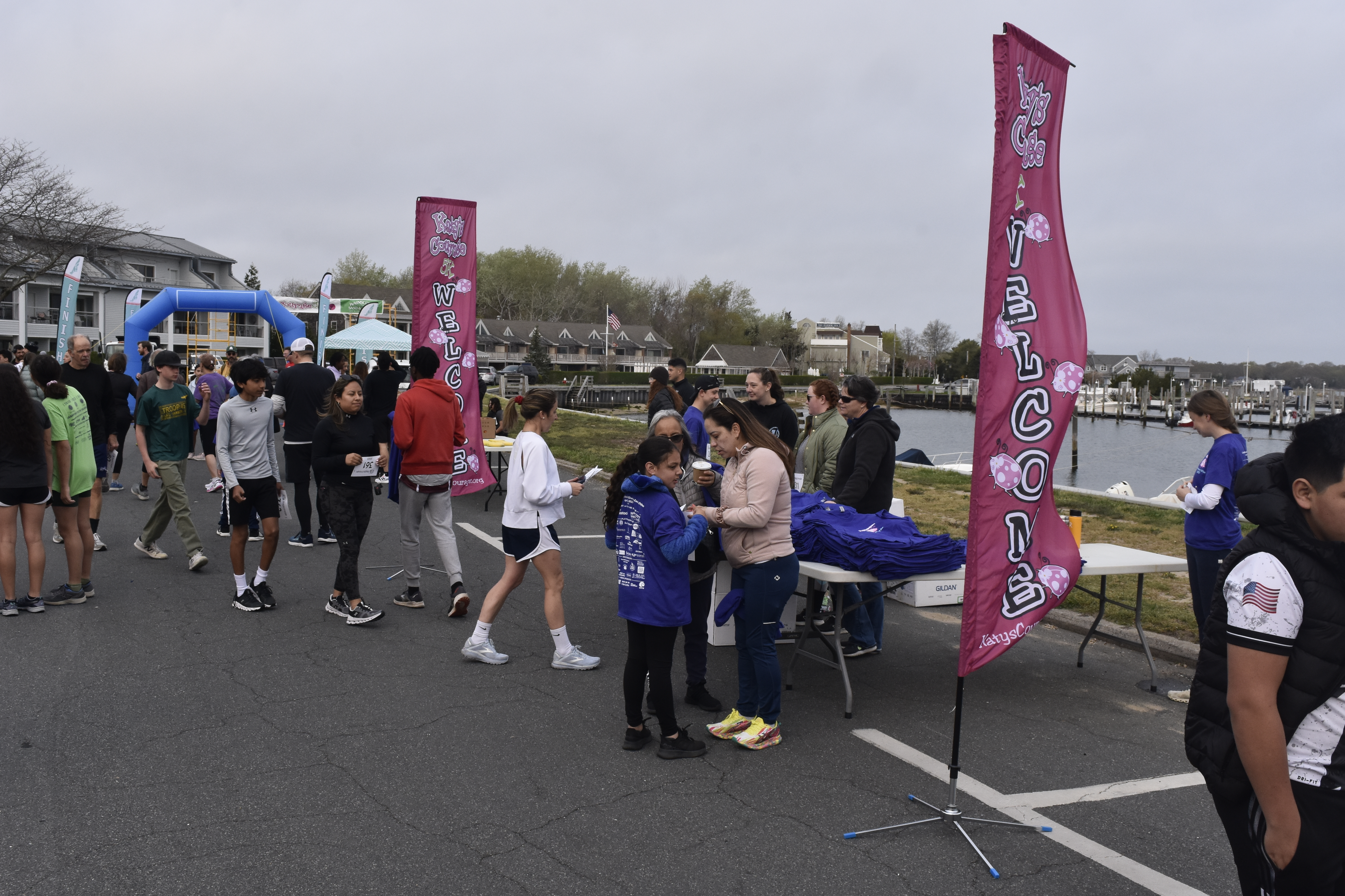 Participants of Katy's Courage 5K get their t-shirts.   DREW BUDD