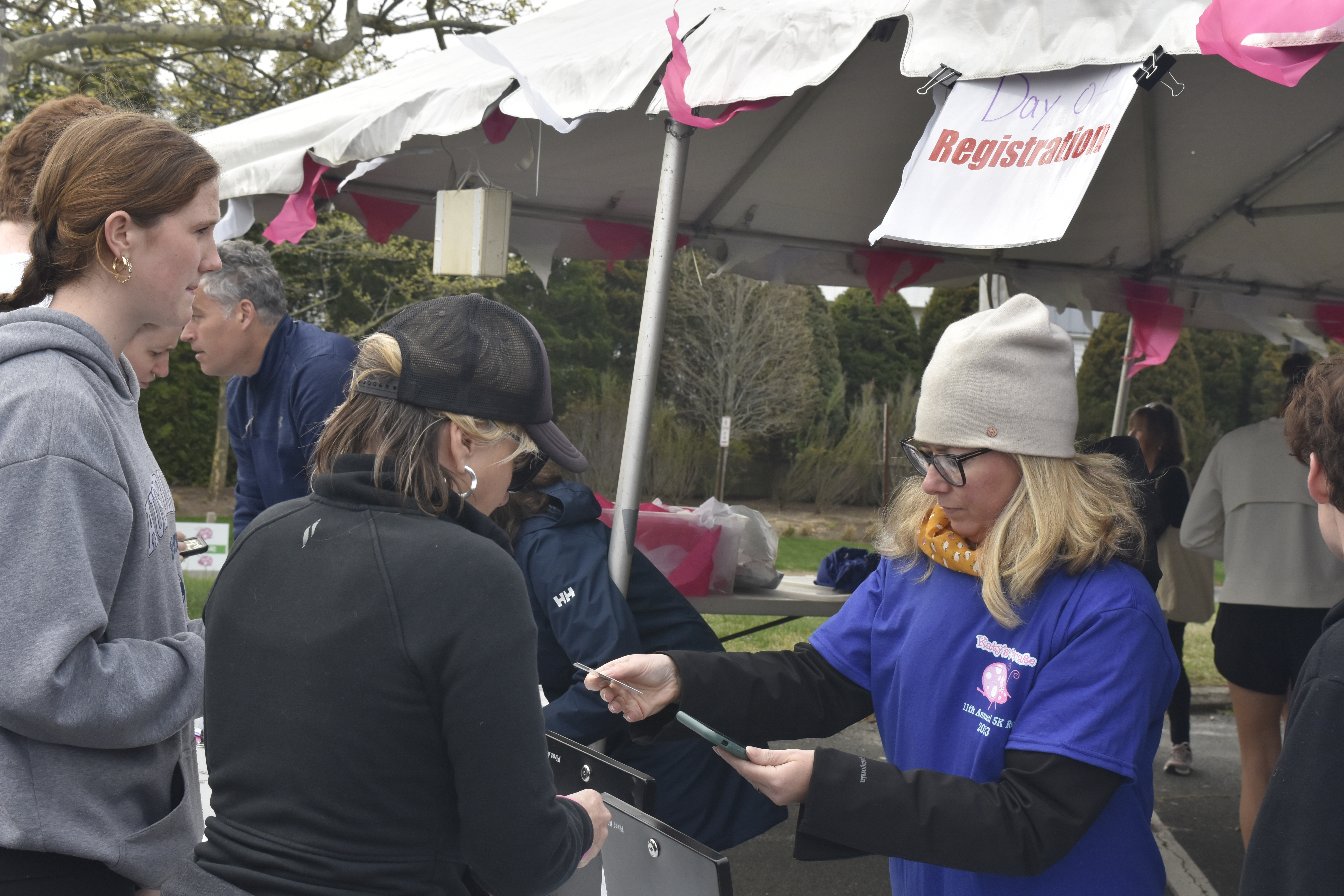 Participants register for the race.  DREW BUDD