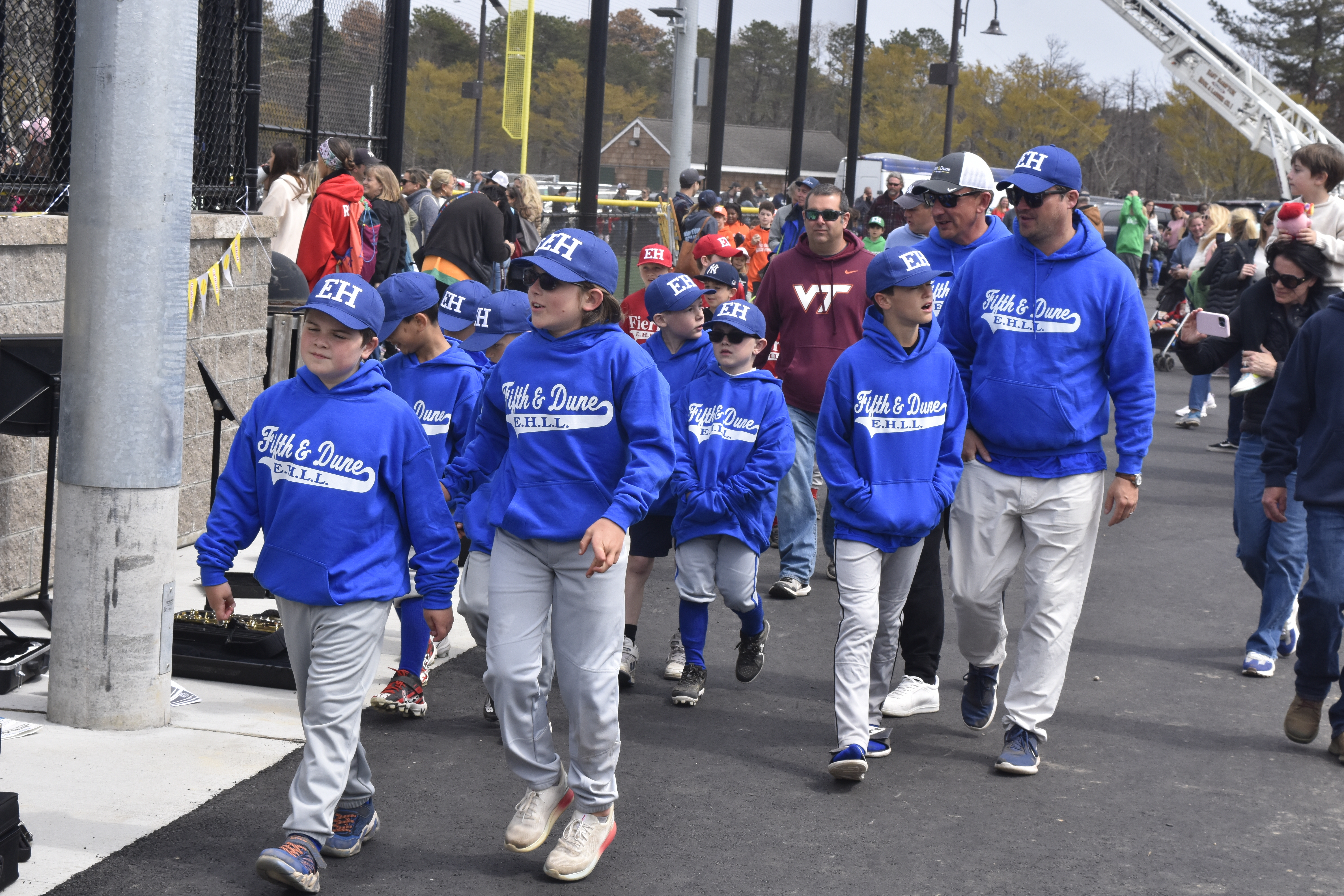 East Hampton Little League's Opening Day parade begins as all of its teams head out onto the field.   DREW BUDD