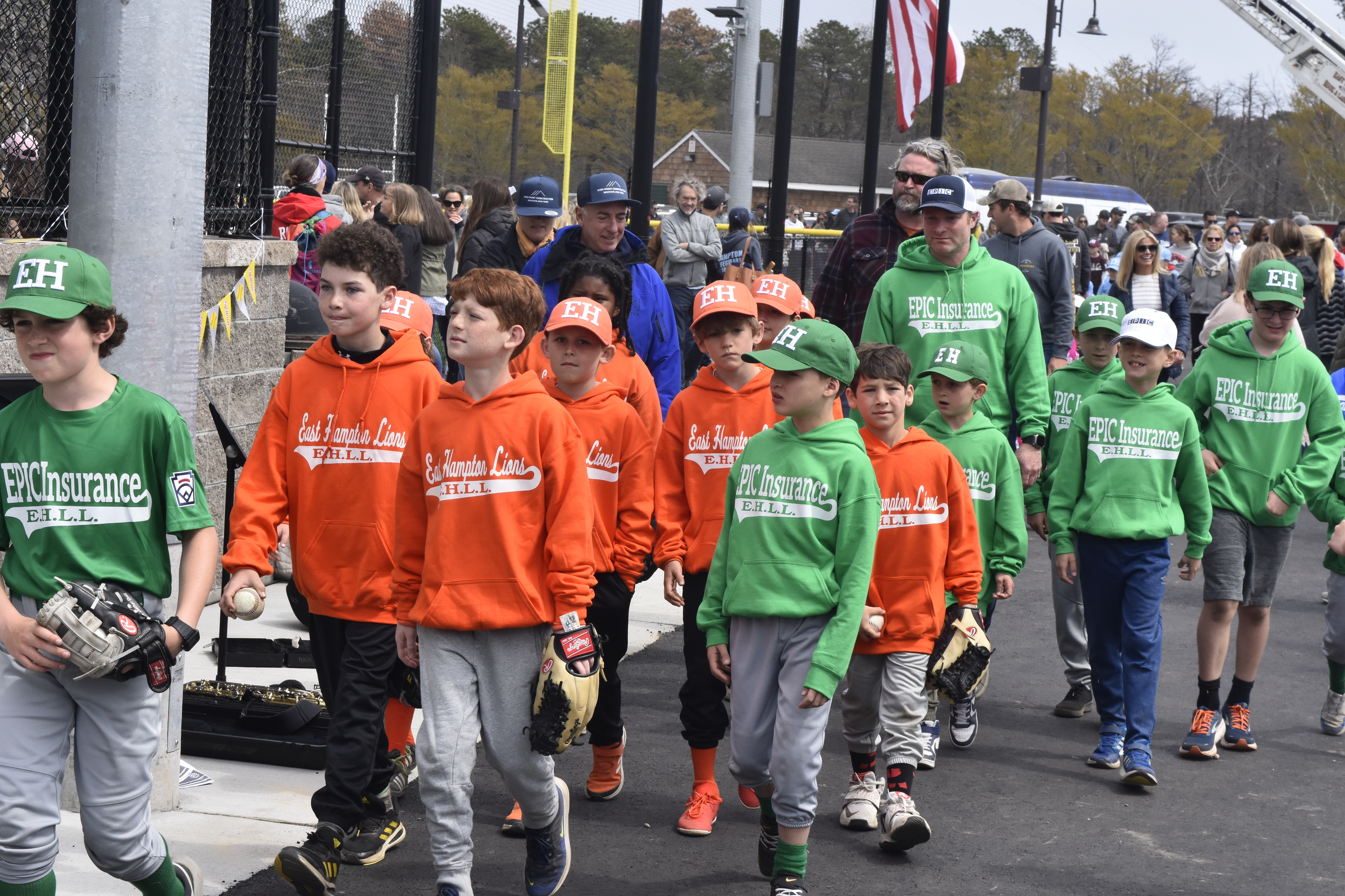 East Hampton Little League's Opening Day parade begins as all of its teams head out onto the field.   DREW BUDD