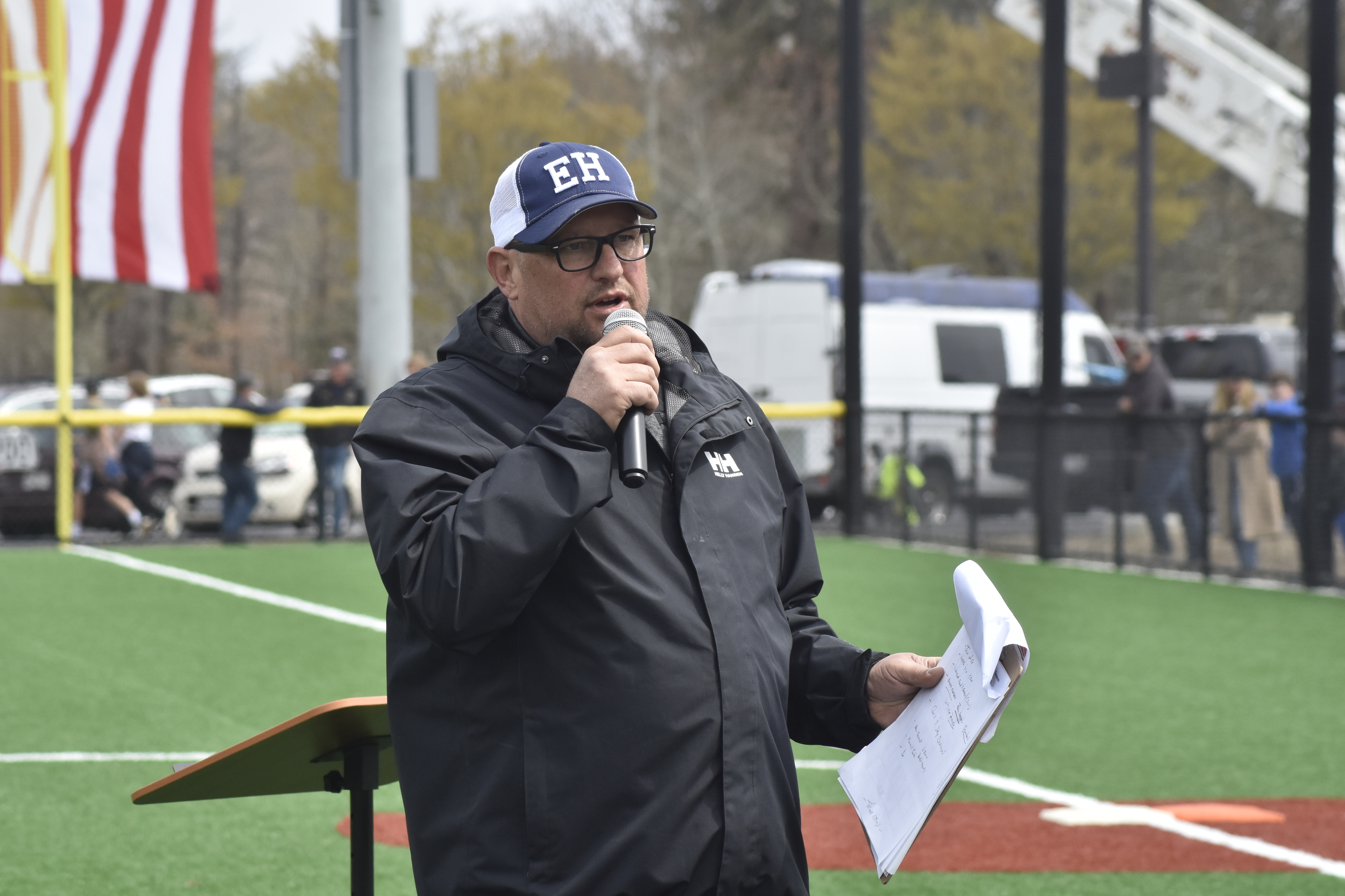 East Hampton Little League President John Grisch speaks to the crowd.   DREW BUDD