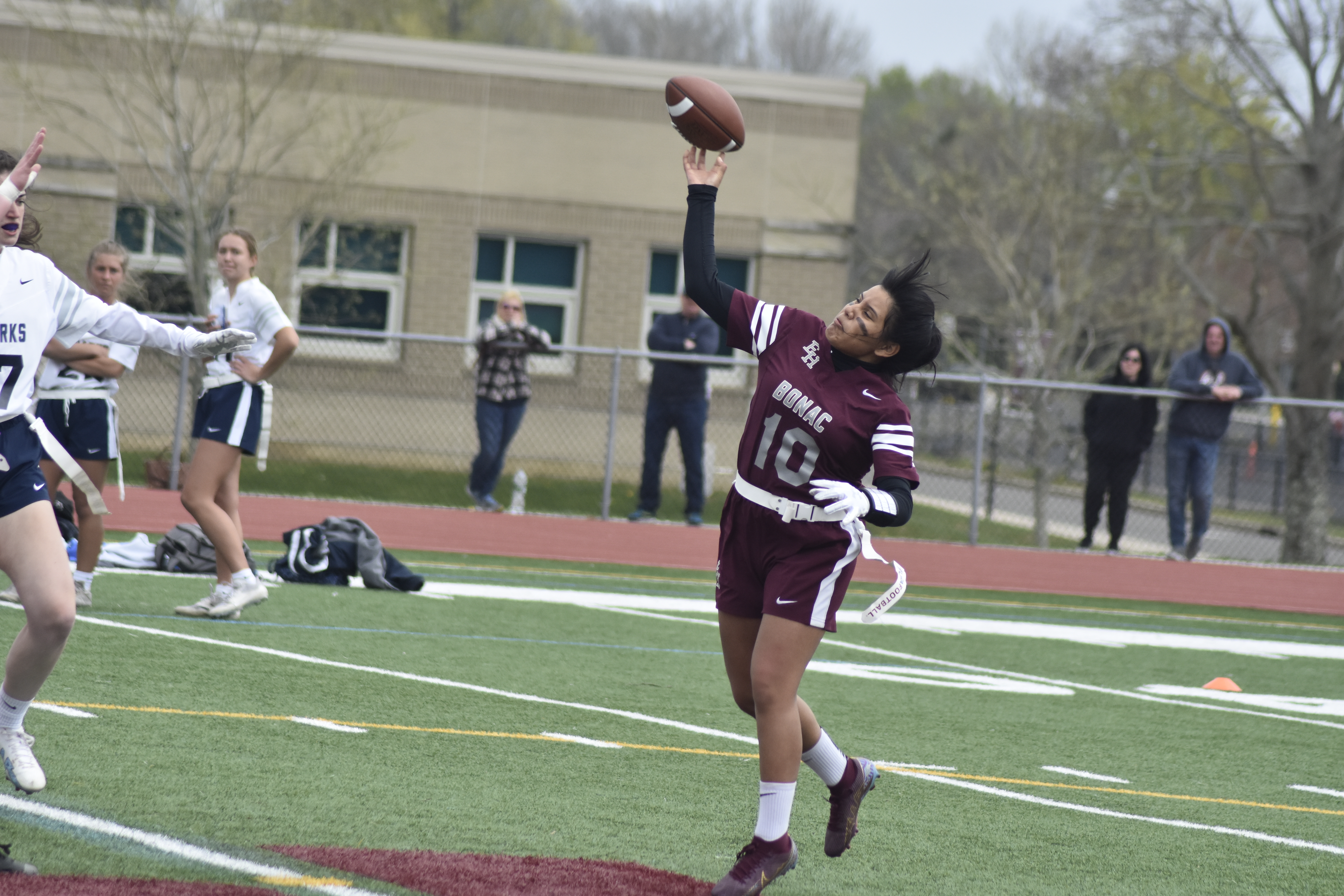 East Hampton's Jocelyn Prieto passes after taking a toss in the backfield.   DREW BUDD