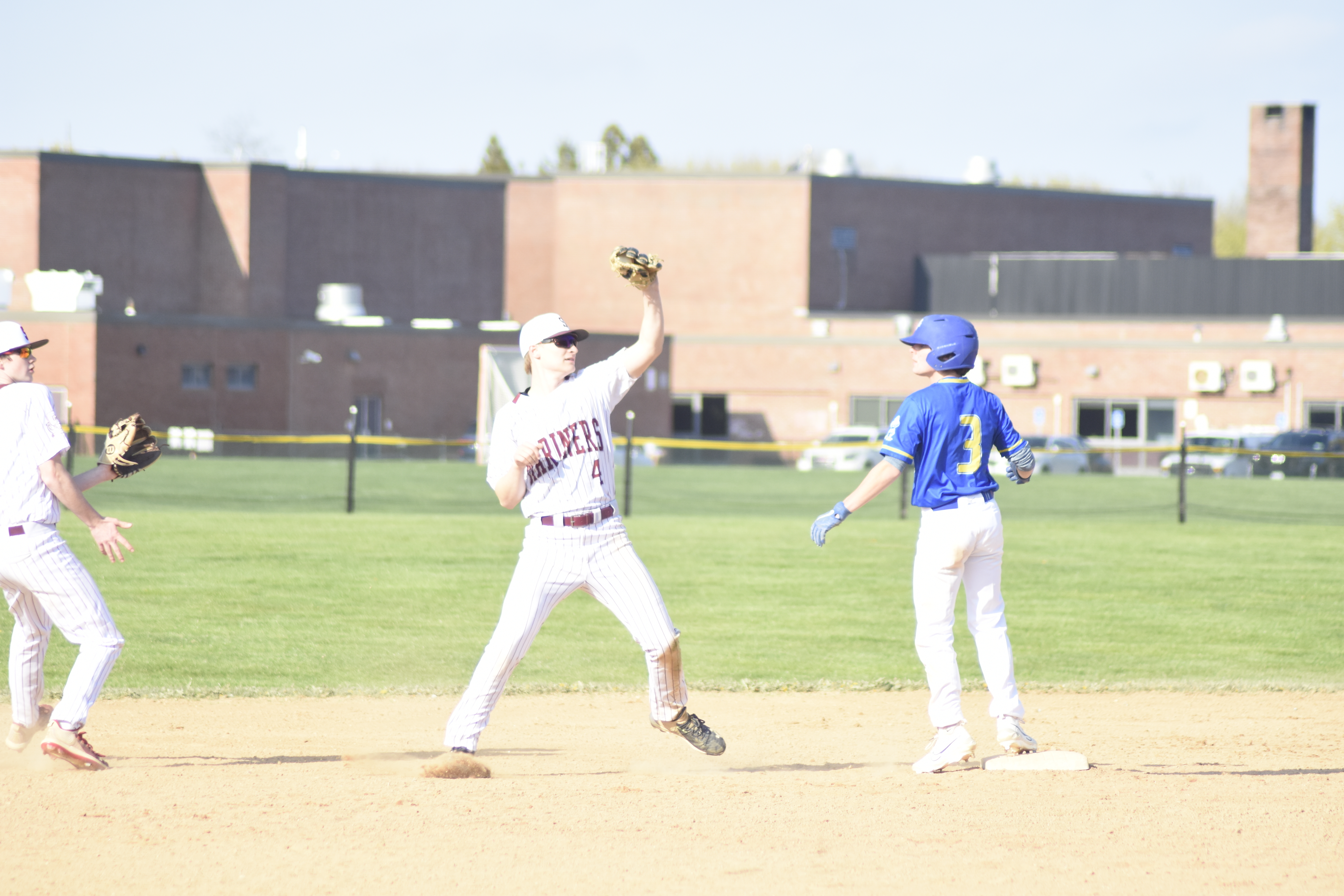 Mariner Riley Herrmann catches a pop up behind second base, a trick play given the runner on the base.   DREW BUDD