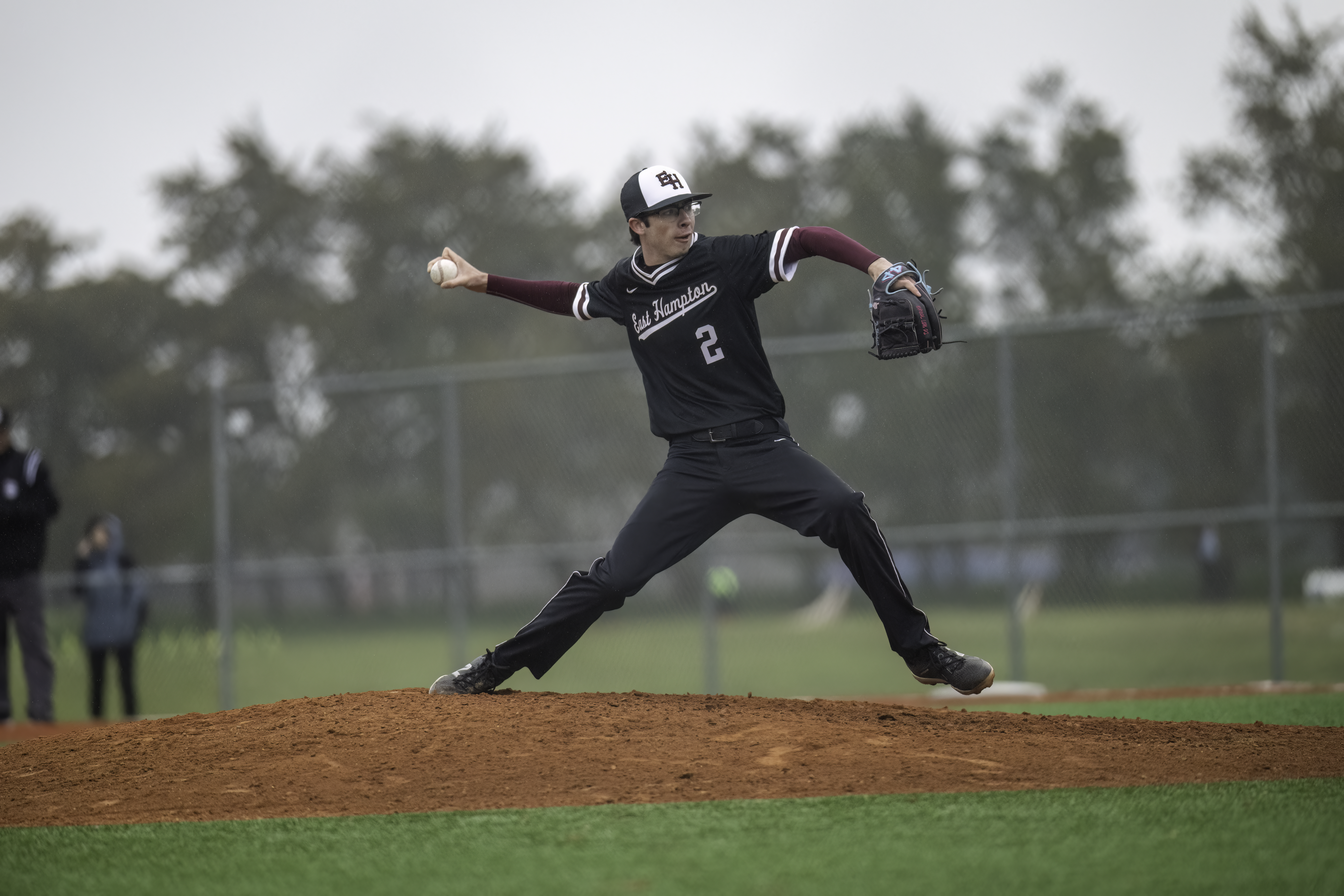 Senior right-handed pitcher Hunter Eberhart winds up for a pitch during the game against Mt. Sinai April 5. MARIANNE BARNETT