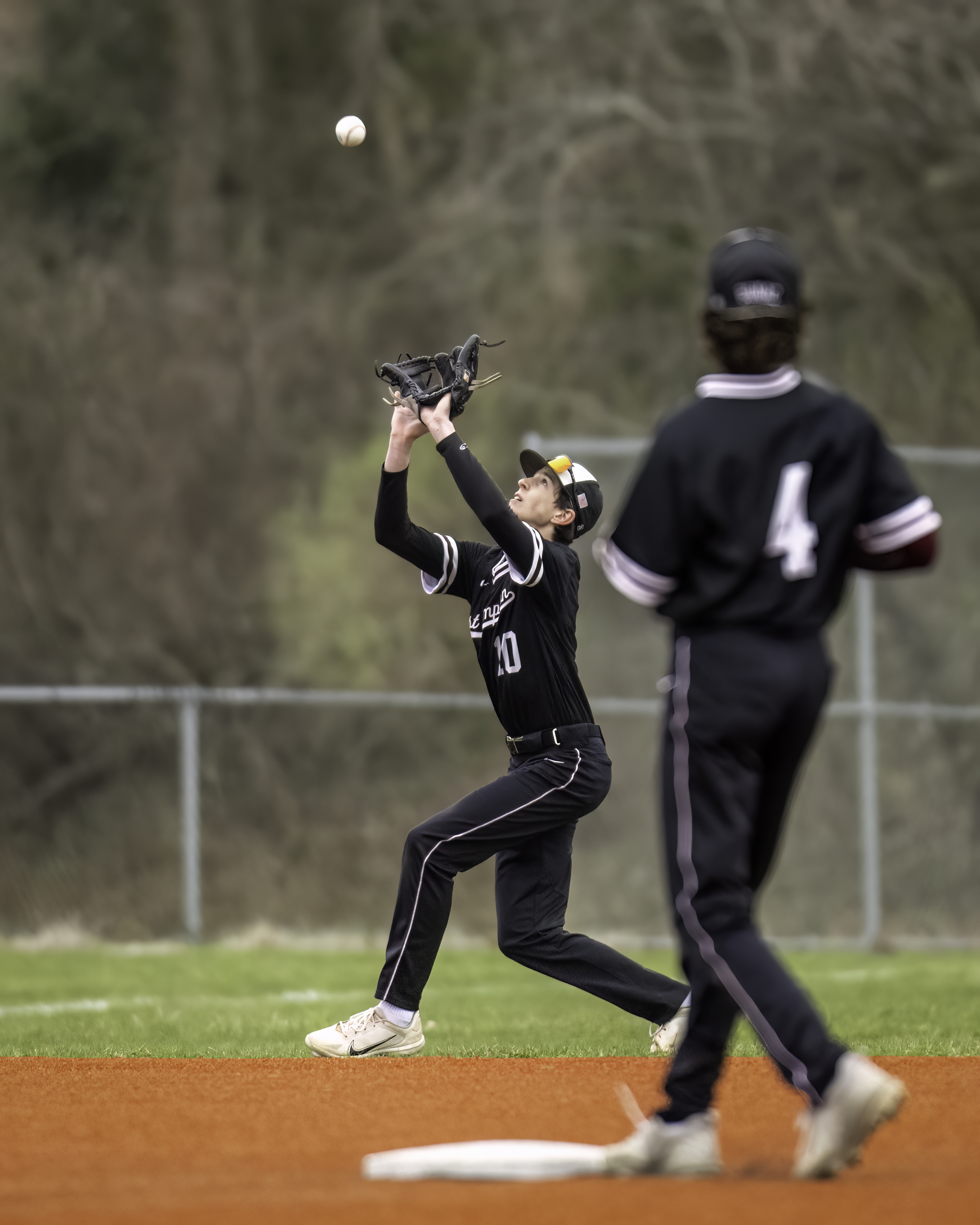 Sophomore short stop and second baseman Tyler Hansen makes a grab during the game against Mt. Sinai April 5. MARIANNE BARNETT