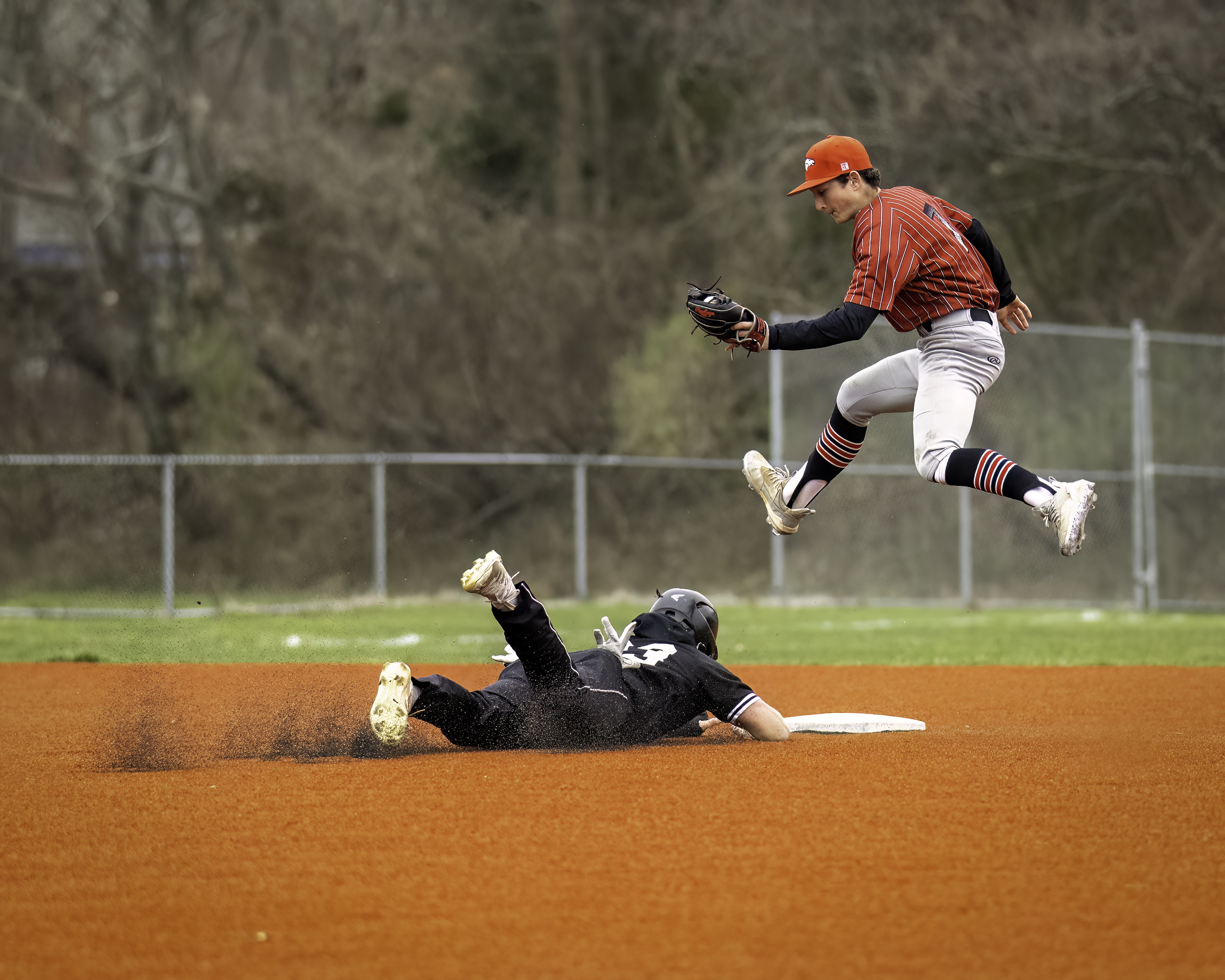 Senior left-handed pitcher and outfielder Will Darrell slides into second during the game against Mt. Sinai April 5. MARIANNE BARNETT