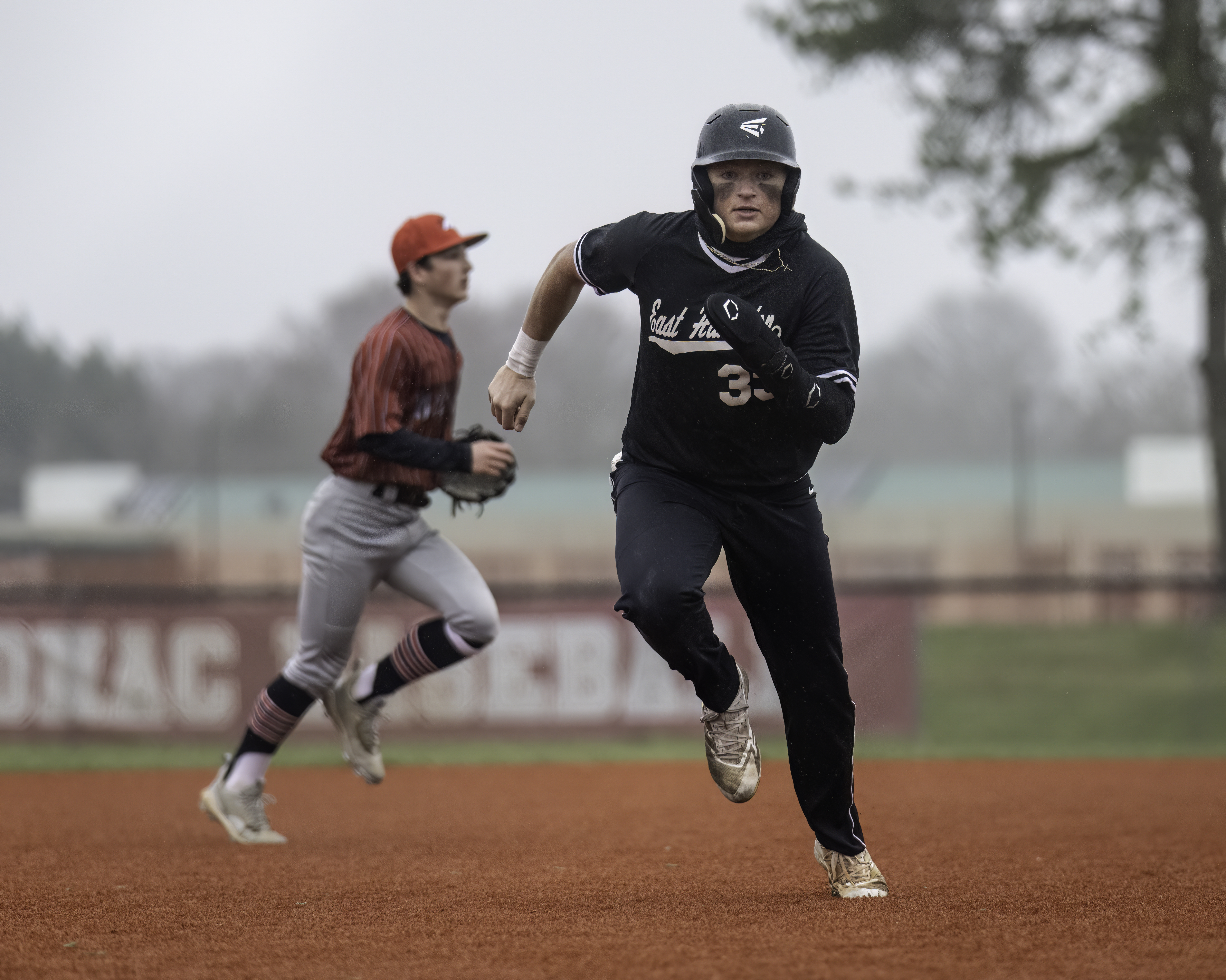 Senior left-handed pitcher and outfielder Will Darrell rounds the bases during the game against Mt. Sinai April 5. MARIANNE BARNETT