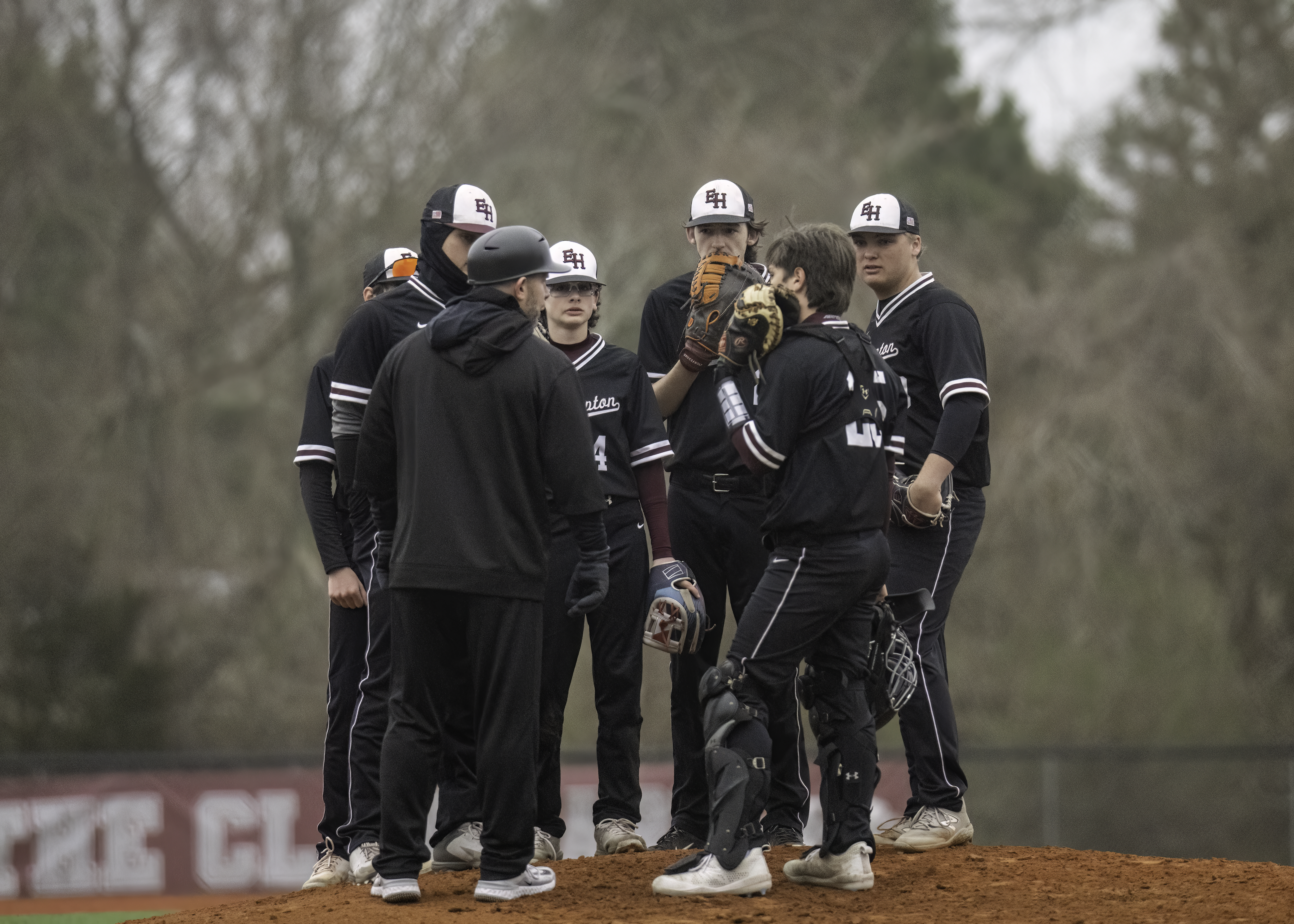 East Hampton's baseball team huddles on the mound during the game against Mt. Sinai April 5. MARIANNE BARNETT