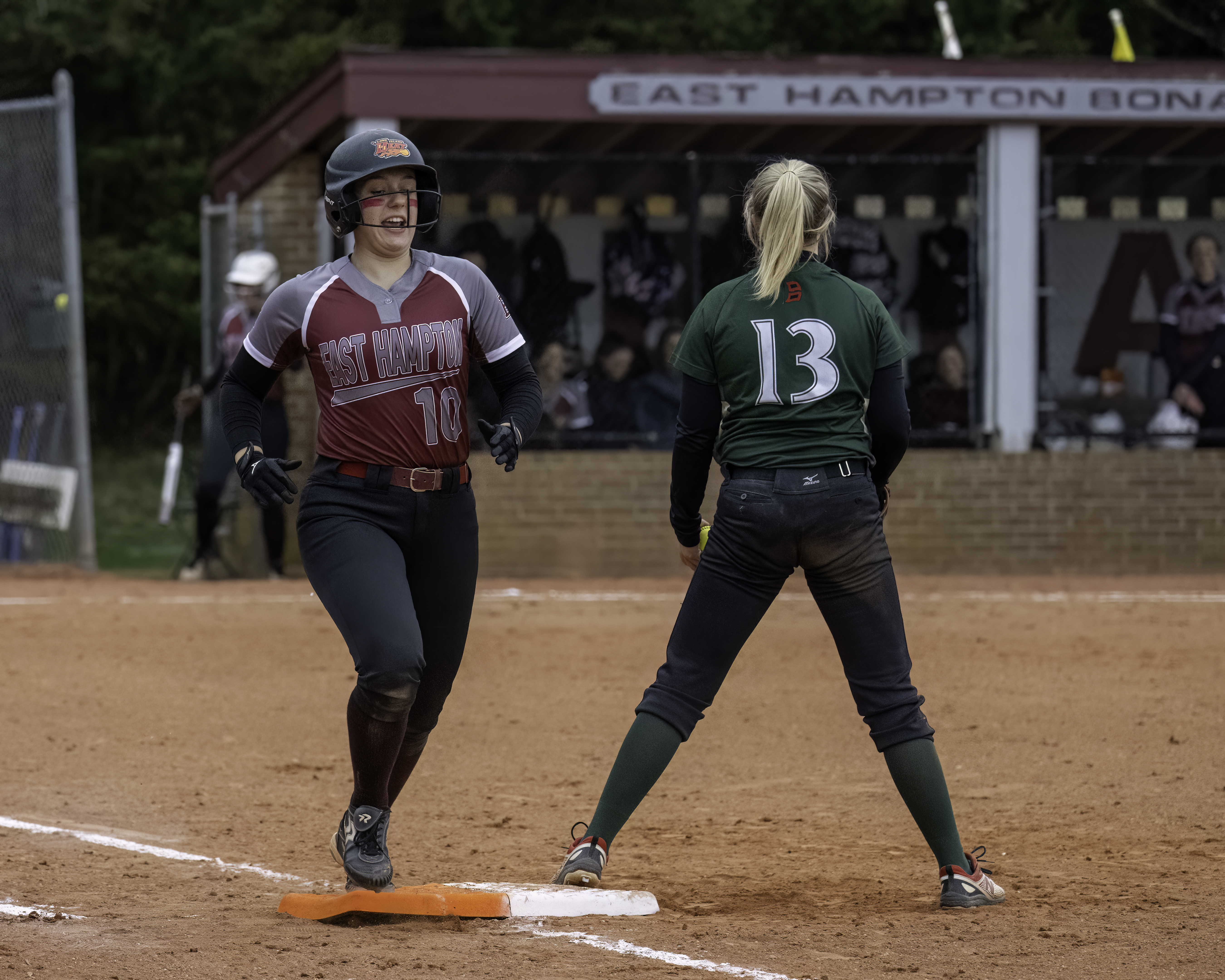 East Hampton junior Katie Kuneth reaches base safely.   MARIANNE BARNETT