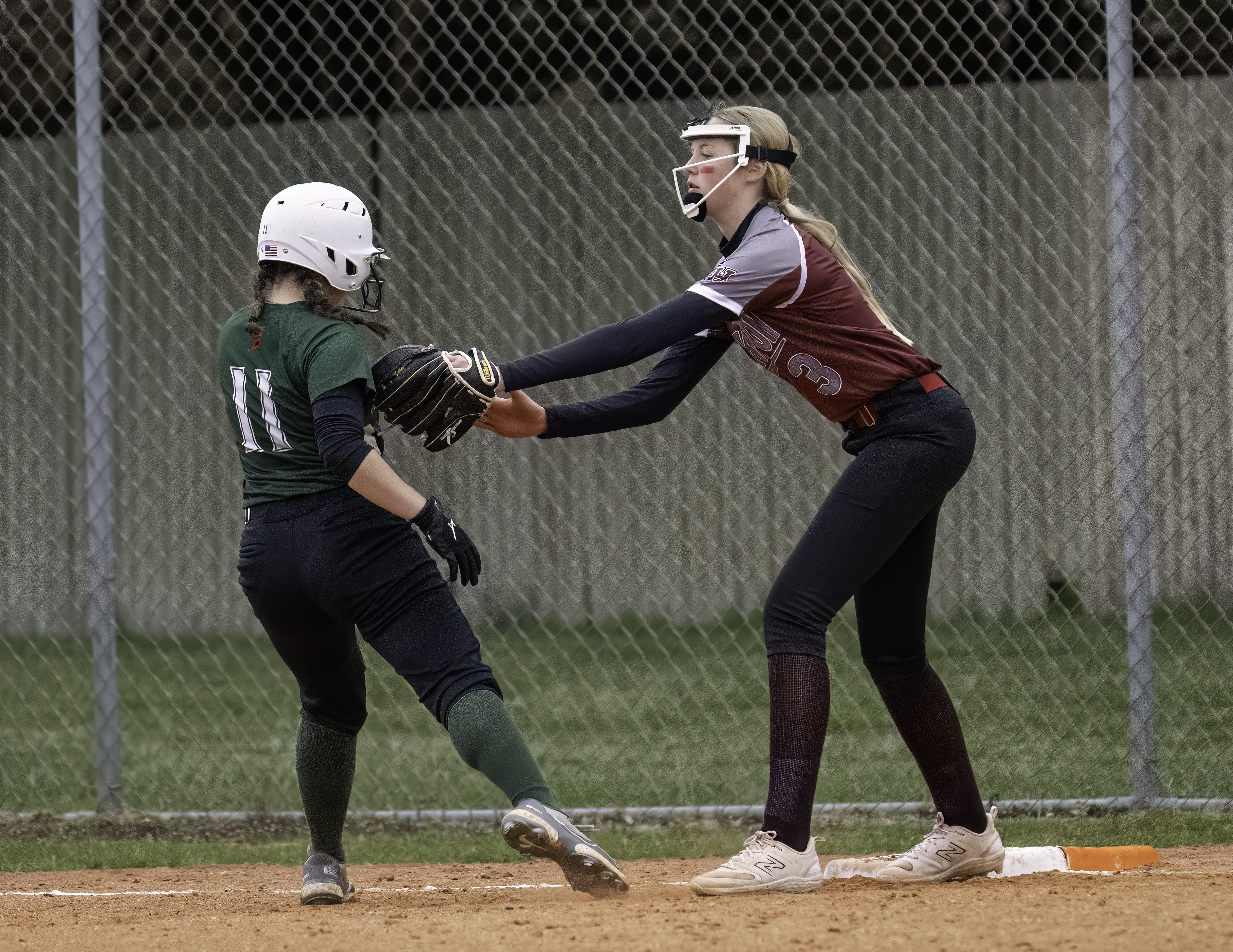 East Hampton freshman Mary Jane Vickers tags out Westhampton Beach  at first base.   MARIANNE BARNETT