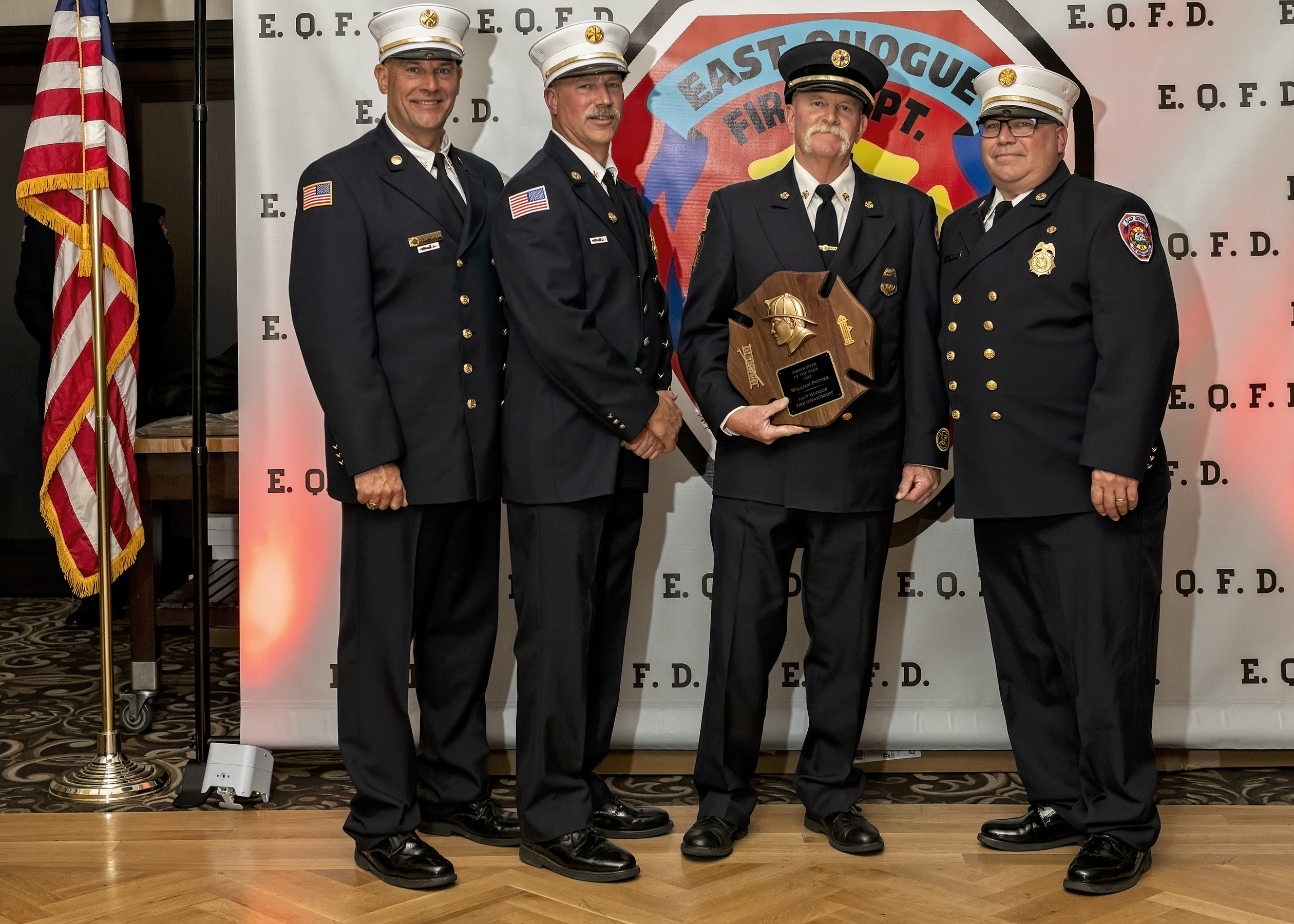 The East Quogue Fire Department honored Ex-chief Bill Potter as the Firefighter of the Year at the department’s installation dinner which was held at the Long Island Aquarium in Riverhead on Saturday. Ex-chief Potter also received the Scotty Oliver Top Responder Award. From the left, Third Assistant Chief Mark Gregory, Second Assistant Chief Glenn Bullock, Ex-chief Potter, and Chief Paul Sulzinski. COURTESY EAST QUOGUE FIRE DEPARTMENT