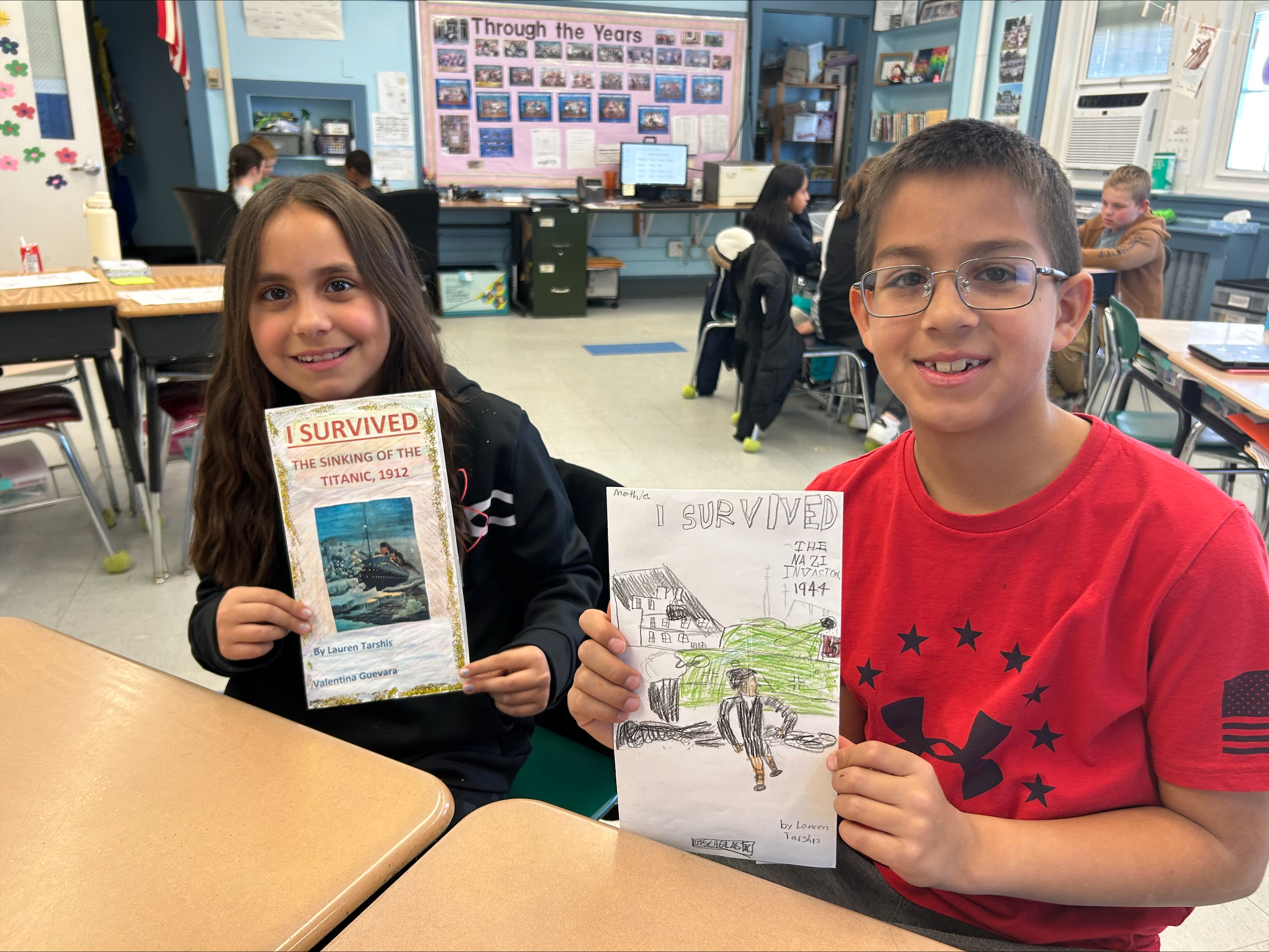 Hampton Bays Elementary School students in Amy McNamara's and Morgan Tiska's class, including Valentina Guevara and Mathias Herbel-Monsalve, recently created book jackets and book reports as part of a historical fiction unit. After reading a work of historical fiction, the students wrote a summary and provided information on the characters and the work’s historical context. To complete their reports,
they enclosed them in book jackets that they had illustrated. They also presented their projects and made book recommendations to their classmates. COURTESY HAMPTON BAYS SCHOOL DISTRICT