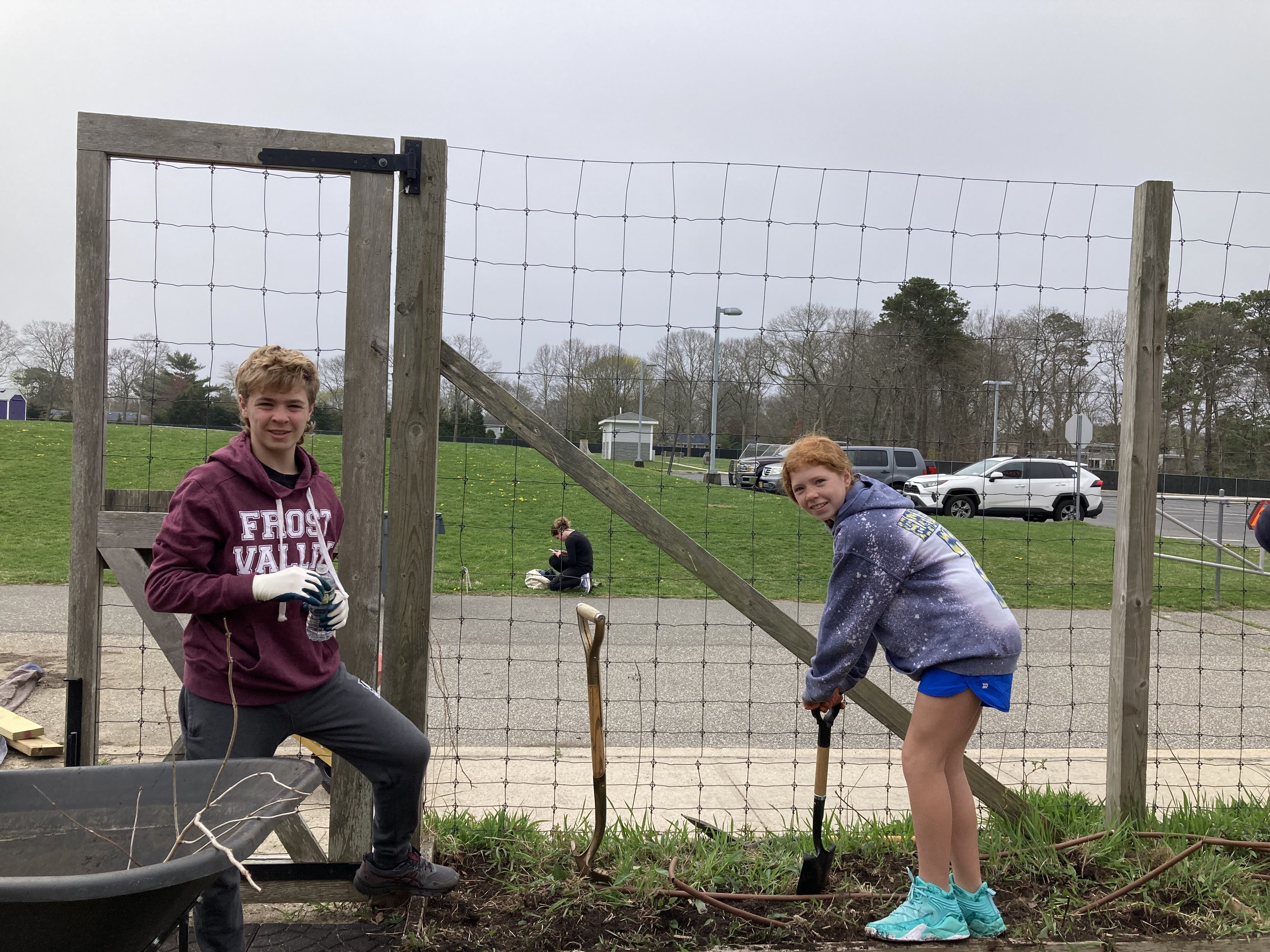 Hampton Bays Middle School students, Garden Club members, along with community volunteers,  cleaned and weeded the perimeter of the community-school garden. Participants also assisted in filling garden beds with new topsoil to prepare them for spring planting. Students will soon be planting an herb garden that will be shared with community garden members. COURTESY HAMPTON BAYS SCHOOL DISTRICT
