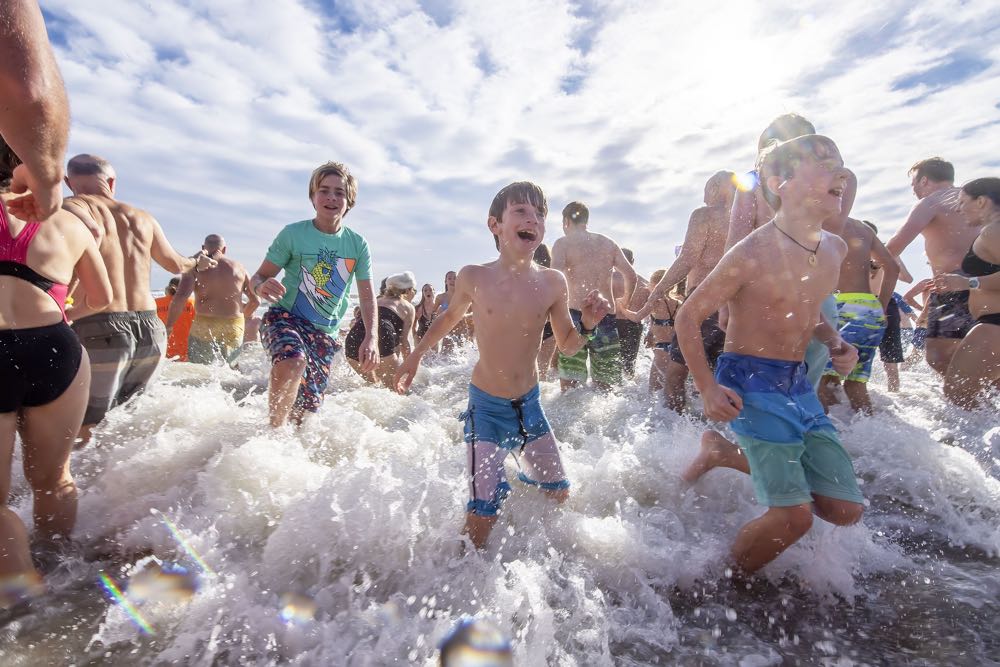 Hundreds of plungers took to the ocean off Main Beach in East Hampton on Tuesday